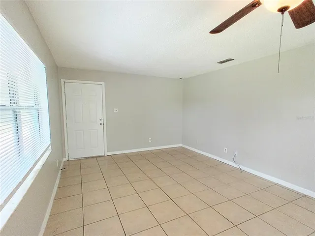 a view of an empty room and window