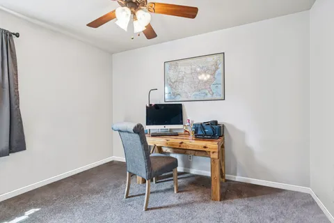 a view of a workspace with furniture