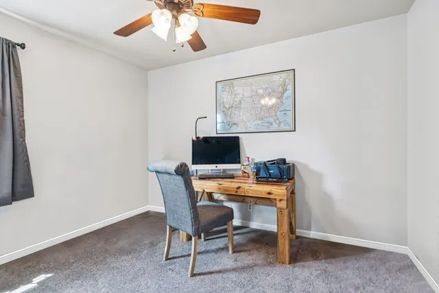 a view of a workspace with furniture