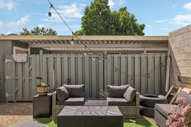 a view of a garage with parked cars