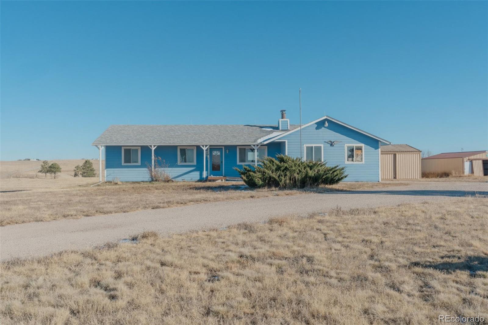 45922 Summit Road Parker, CO 80138 - Photo 1 of 35 a front view of a house with a yard