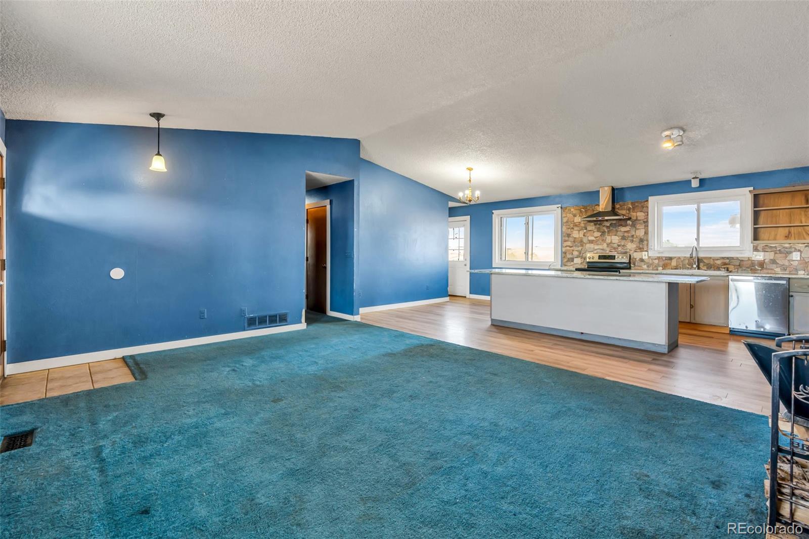 45922 Summit Road Parker, CO 80138 - Photo 11 of 35 a view of a kitchen with a sink and a refrigerator