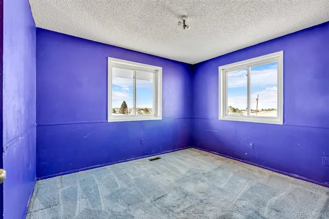 a bathroom with a toilet and a sink