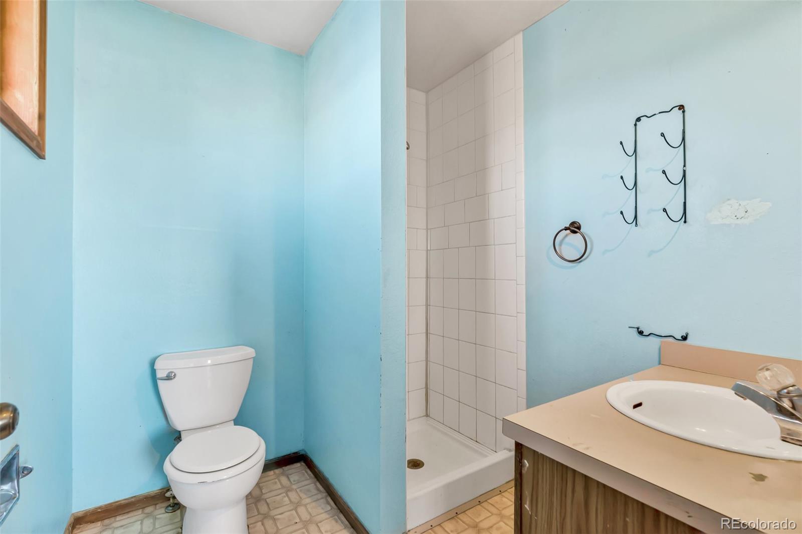 45922 Summit Road Parker, CO 80138 - Photo 16 of 35 a bathroom with a toilet and a sink