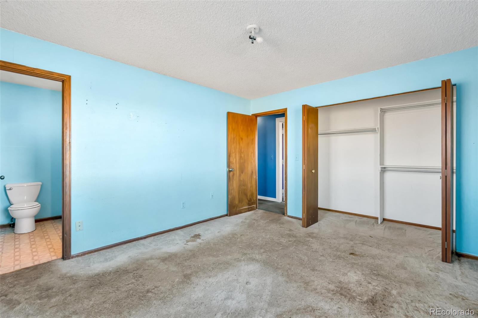 45922 Summit Road Parker, CO 80138 - Photo 17 of 35 a view of empty room with wooden floor and bathroom