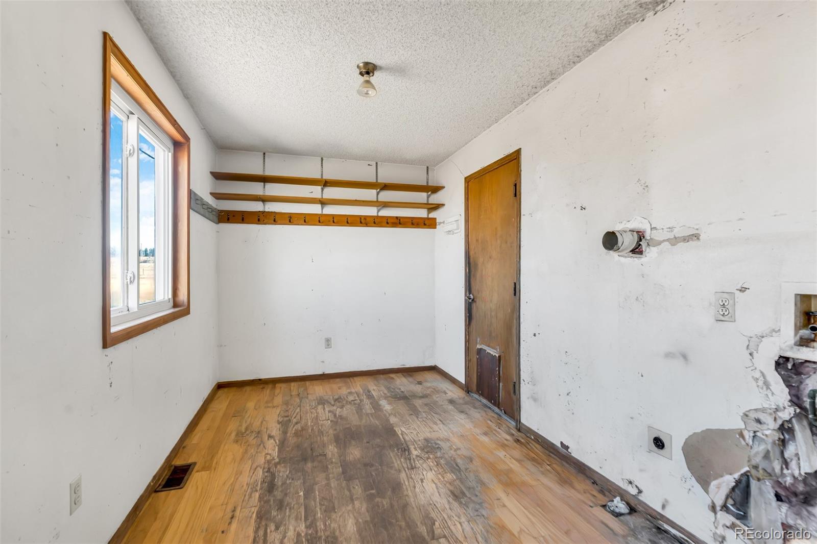 45922 Summit Road Parker, CO 80138 - Photo 25 of 35 a view of empty room with wooden floor and fan