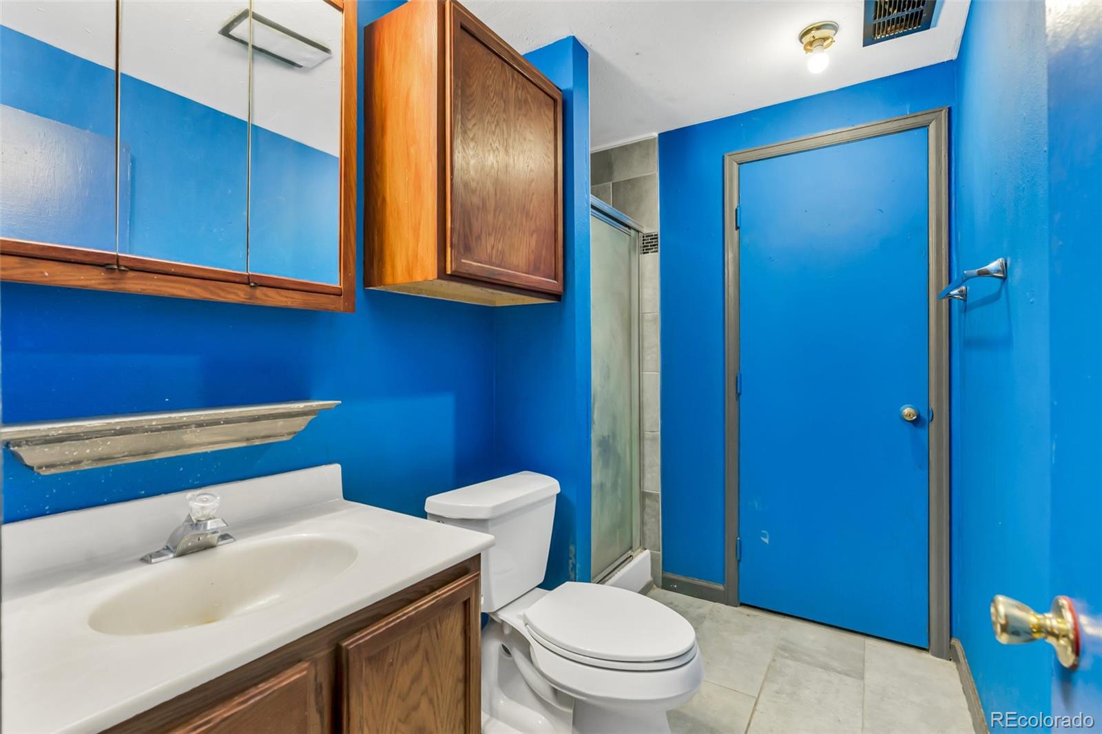 45922 Summit Road Parker, CO 80138 - Photo 26 of 35 a bathroom with a sink a toilet and mirror