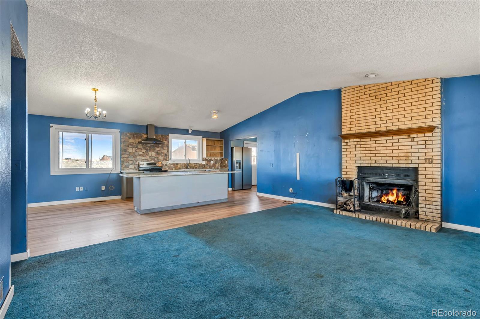 45922 Summit Road Parker, CO 80138 - Photo 10 of 35 a view of an empty room with a fireplace and a window