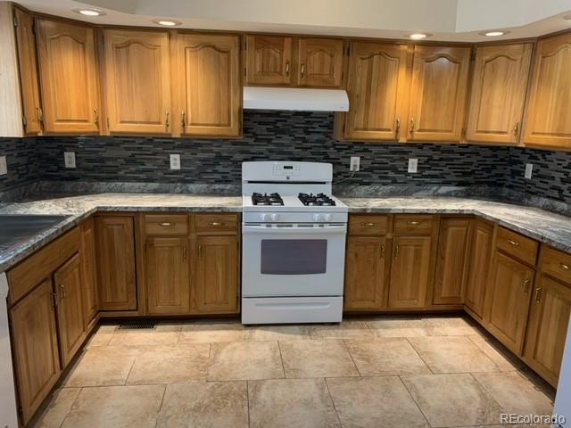 201 Bluebird Drive Bailey, CO 80421 - Photo 15 of 45 a kitchen with a stove sink and cabinets