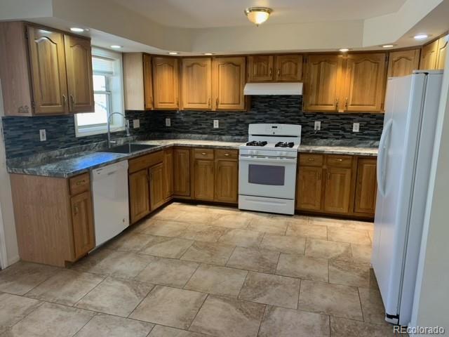 201 Bluebird Drive Bailey, CO 80421 - Photo 17 of 45 a kitchen with stainless steel appliances granite countertop a stove a sink and a refrigerator