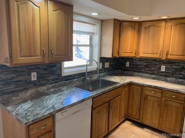 201 Bluebird Drive Bailey, CO 80421 - Photo 19 of 45 a kitchen with granite countertop a sink and a white wooden cabinets