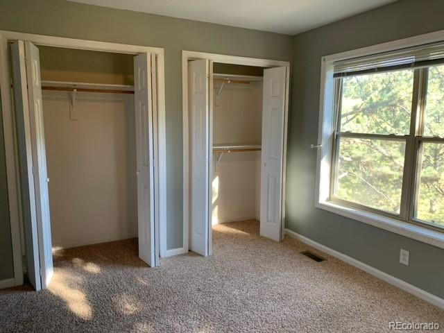 201 Bluebird Drive Bailey, CO 80421 - Photo 26 of 45 a view of empty room with windows and refrigerator