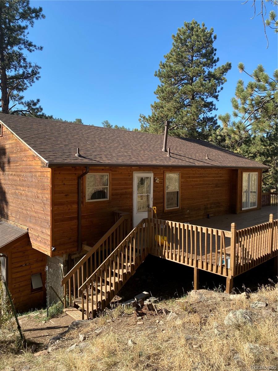 201 Bluebird Drive Bailey, CO 80421 - Photo 3 of 45 a view of a house with a wooden fence