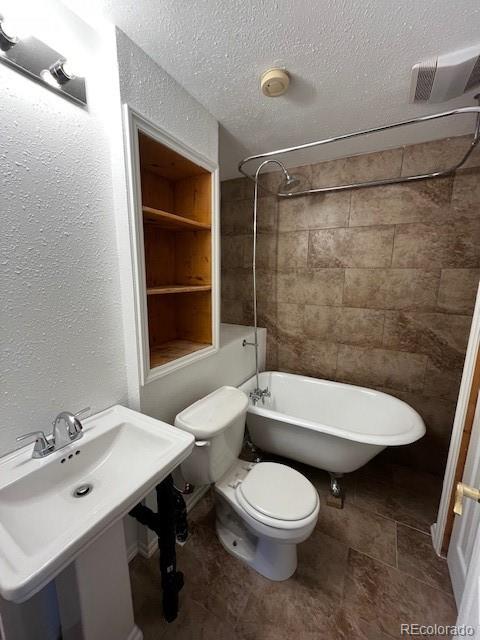 201 Bluebird Drive Bailey, CO 80421 - Photo 32 of 45 a bathroom with a sink a toilet and shower