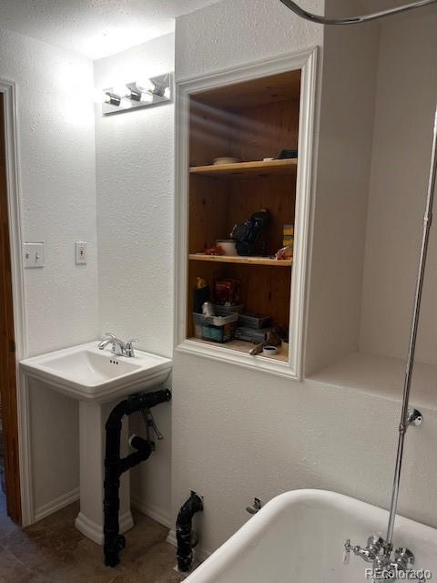 201 Bluebird Drive Bailey, CO 80421 - Photo 34 of 45 a bathroom with a sink and a mirror