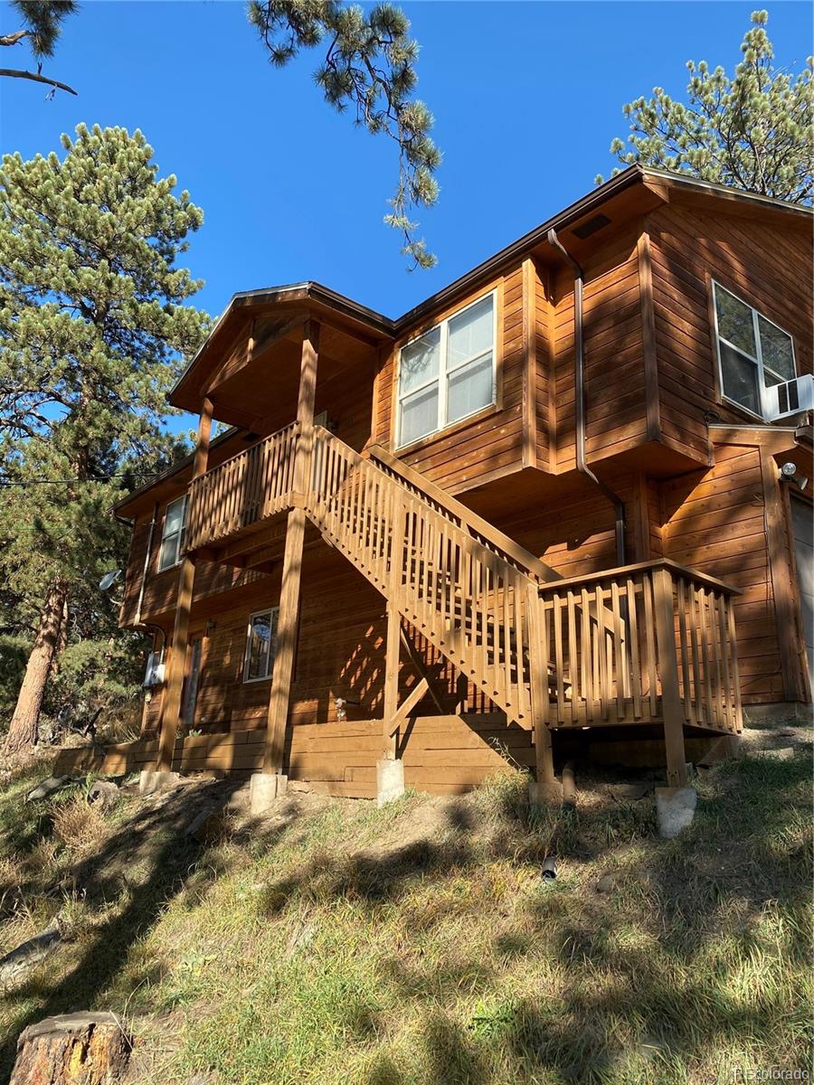 201 Bluebird Drive Bailey, CO 80421 - Photo 4 of 45 a view of a house with a yard