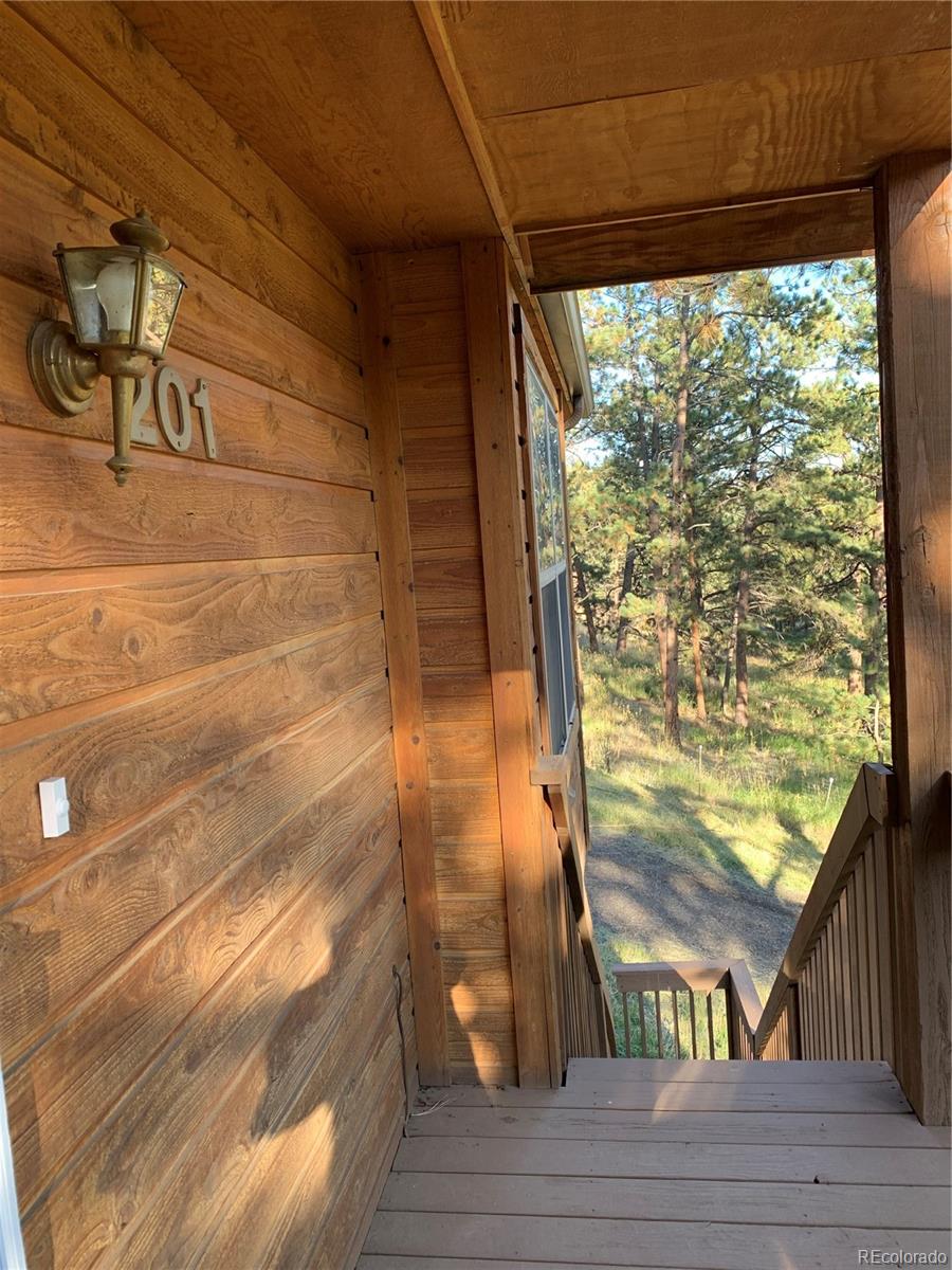 201 Bluebird Drive Bailey, CO 80421 - Photo 5 of 45 a view of entryway with wooden floor