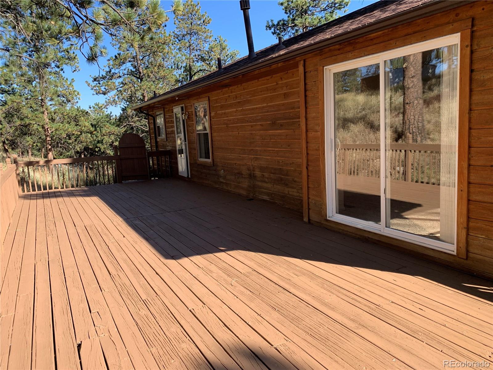 201 Bluebird Drive Bailey, CO 80421 - Photo 7 of 45 a view of backyard with a deck