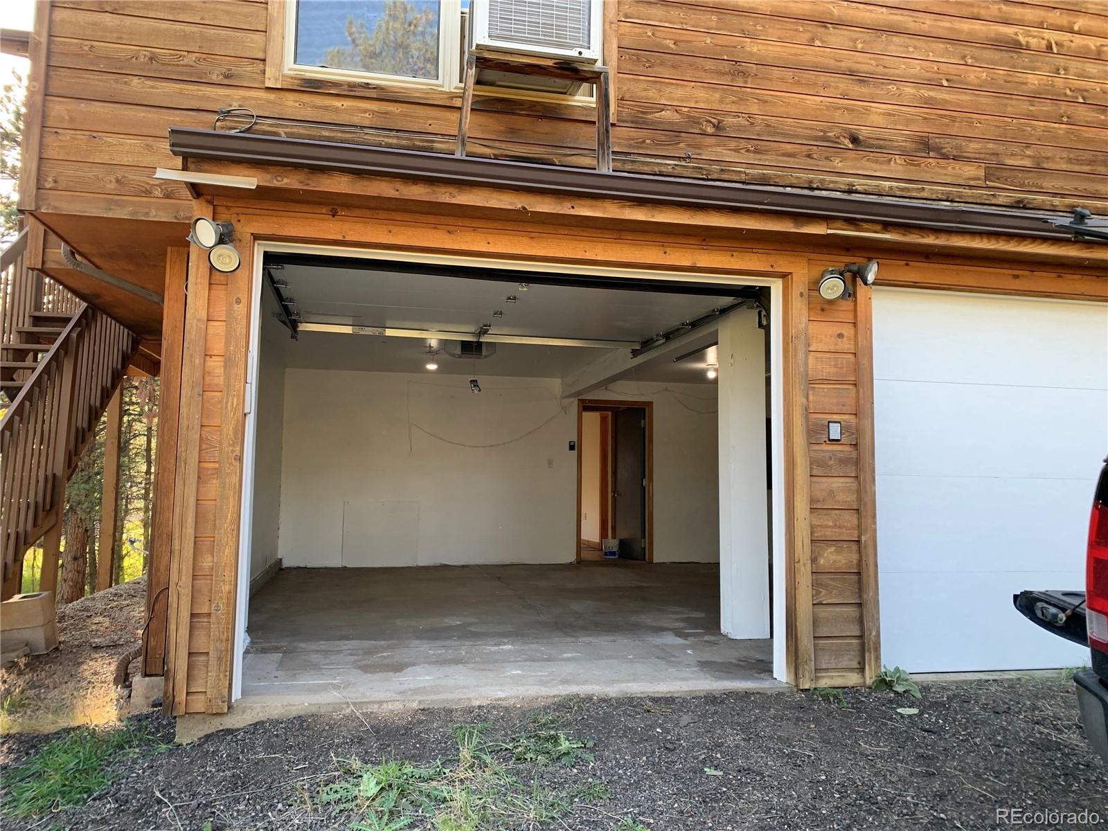 201 Bluebird Drive Bailey, CO 80421 - Photo 8 of 45 a view of front door of house