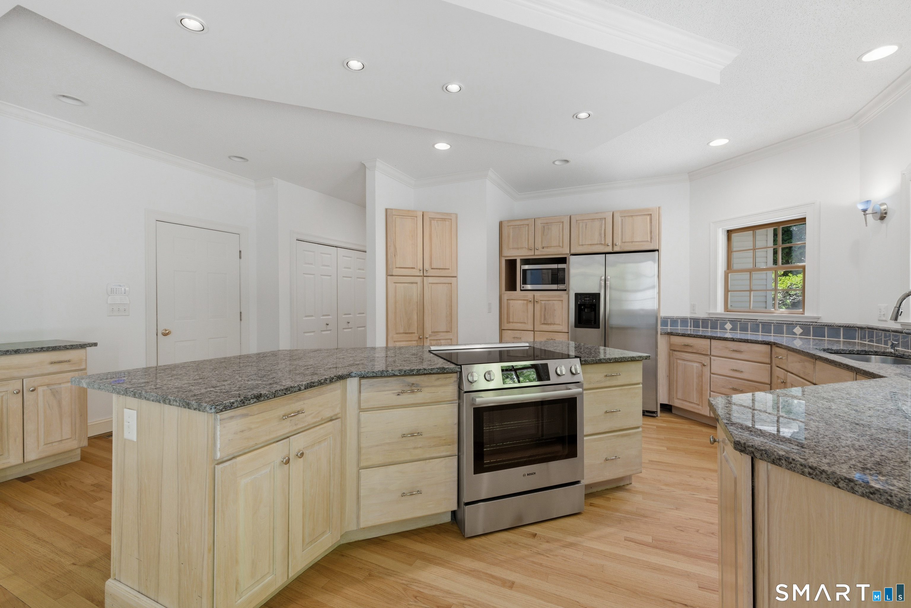 7 Mountainside Road West Hartford, CT 06117 - Photo 13 of 40 a kitchen with stainless steel appliances granite countertop a stove a sink and a granite counter tops