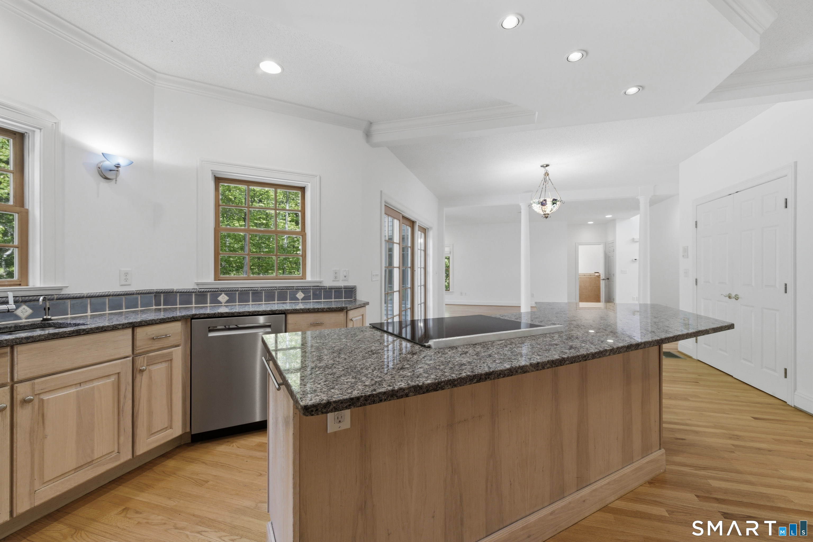 7 Mountainside Road West Hartford, CT 06117 - Photo 14 of 40 a kitchen with granite countertop a sink and a wooden floor