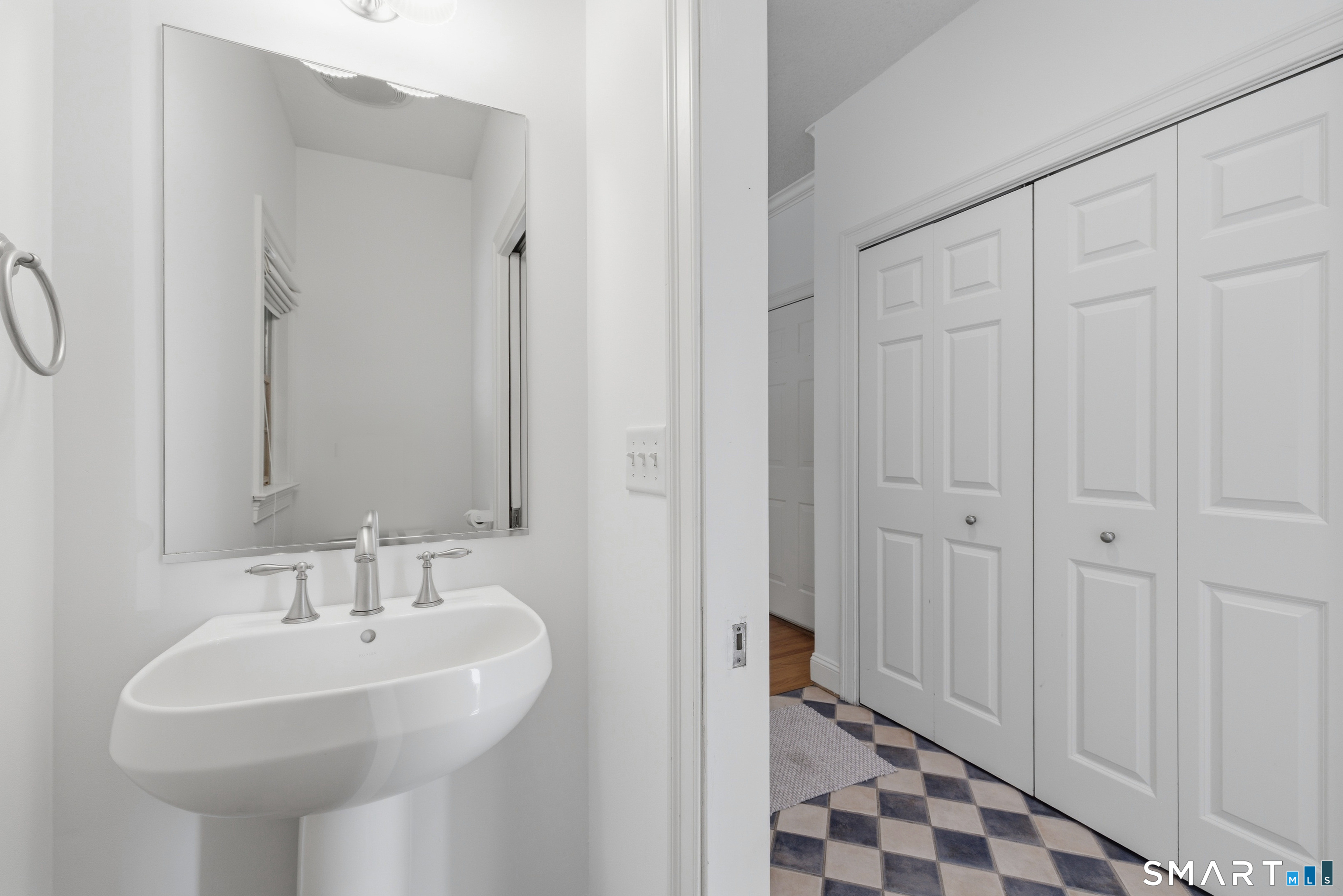 7 Mountainside Road West Hartford, CT 06117 - Photo 19 of 40 a bathroom with a sink and a mirror