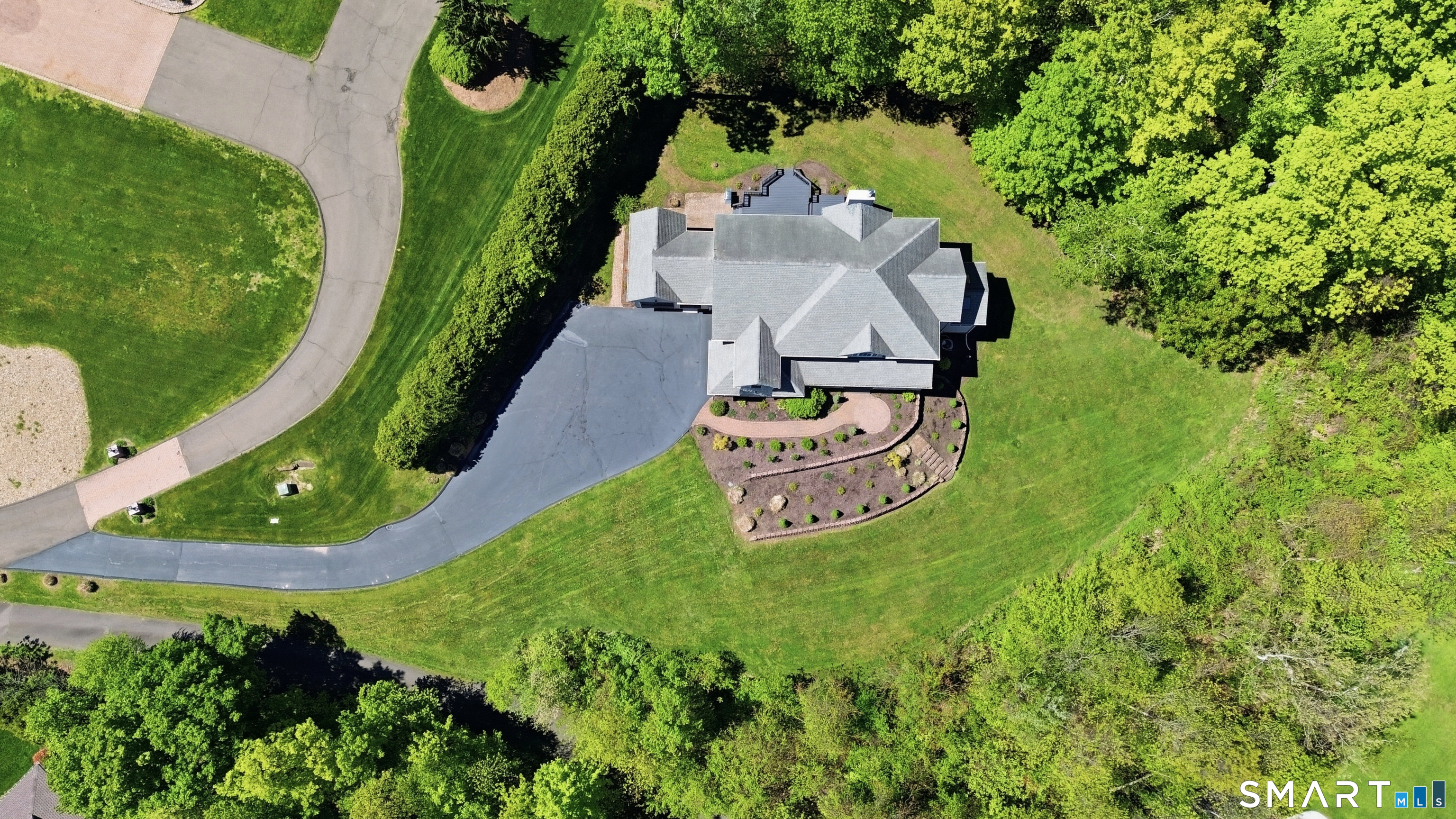 7 Mountainside Road West Hartford, CT 06117 - Photo 2 of 40 an aerial view of a house with outdoor space pool seating area and yard