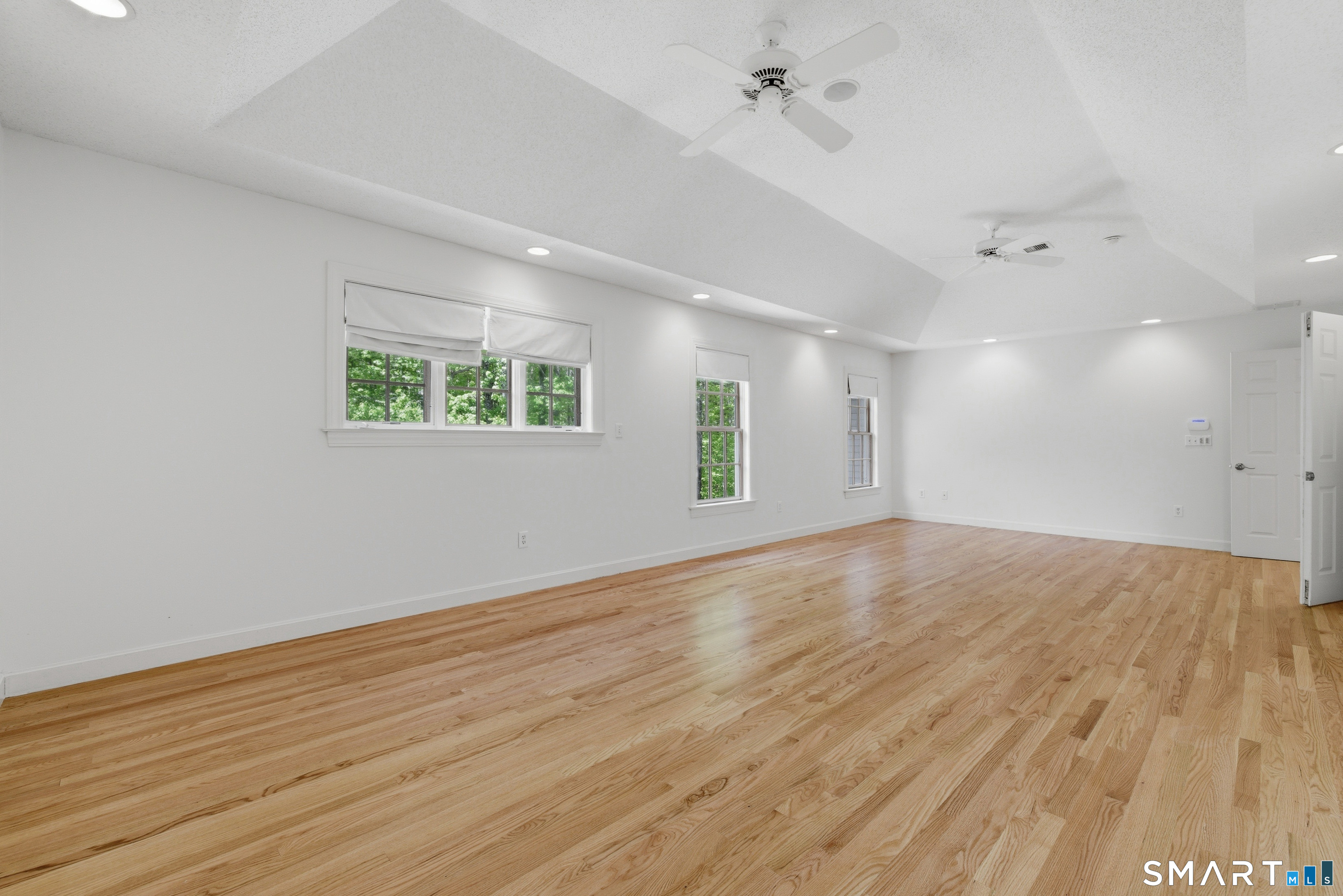 7 Mountainside Road West Hartford, CT 06117 - Photo 22 of 40 an empty room with wooden floor and windows