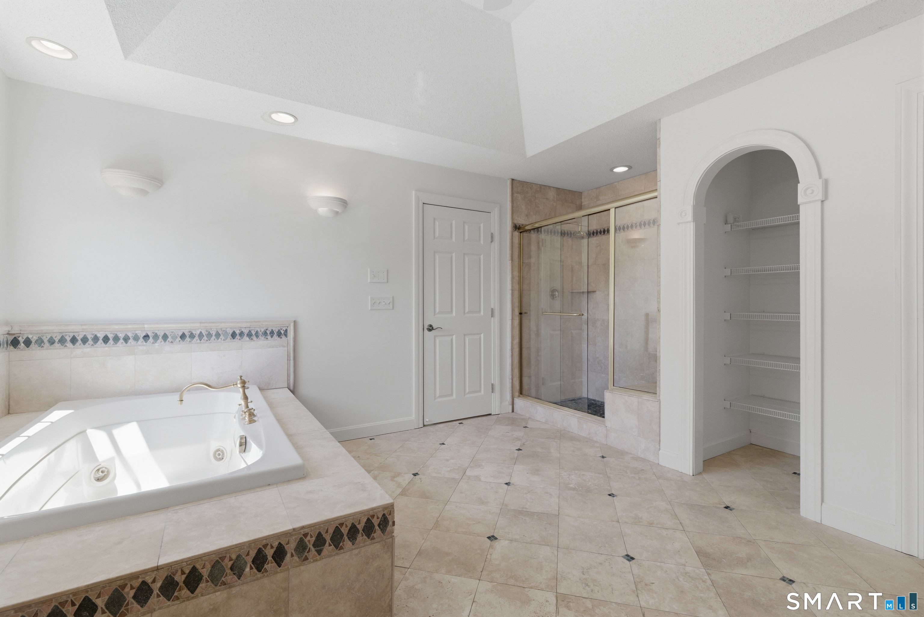 7 Mountainside Road West Hartford, CT 06117 - Photo 24 of 40 a bathroom with a sink a toilet and shower