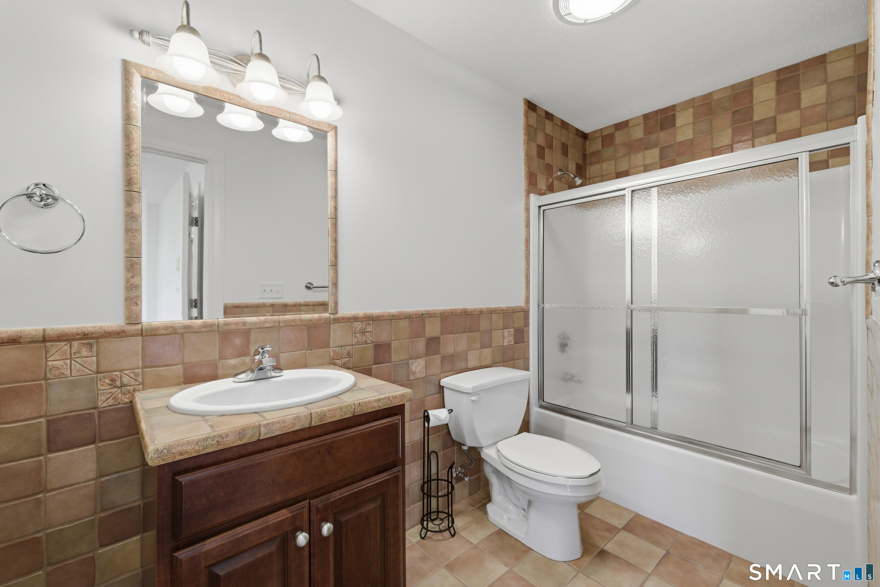 7 Mountainside Road West Hartford, CT 06117 - Photo 29 of 40 a bathroom with a toilet a sink and mirror