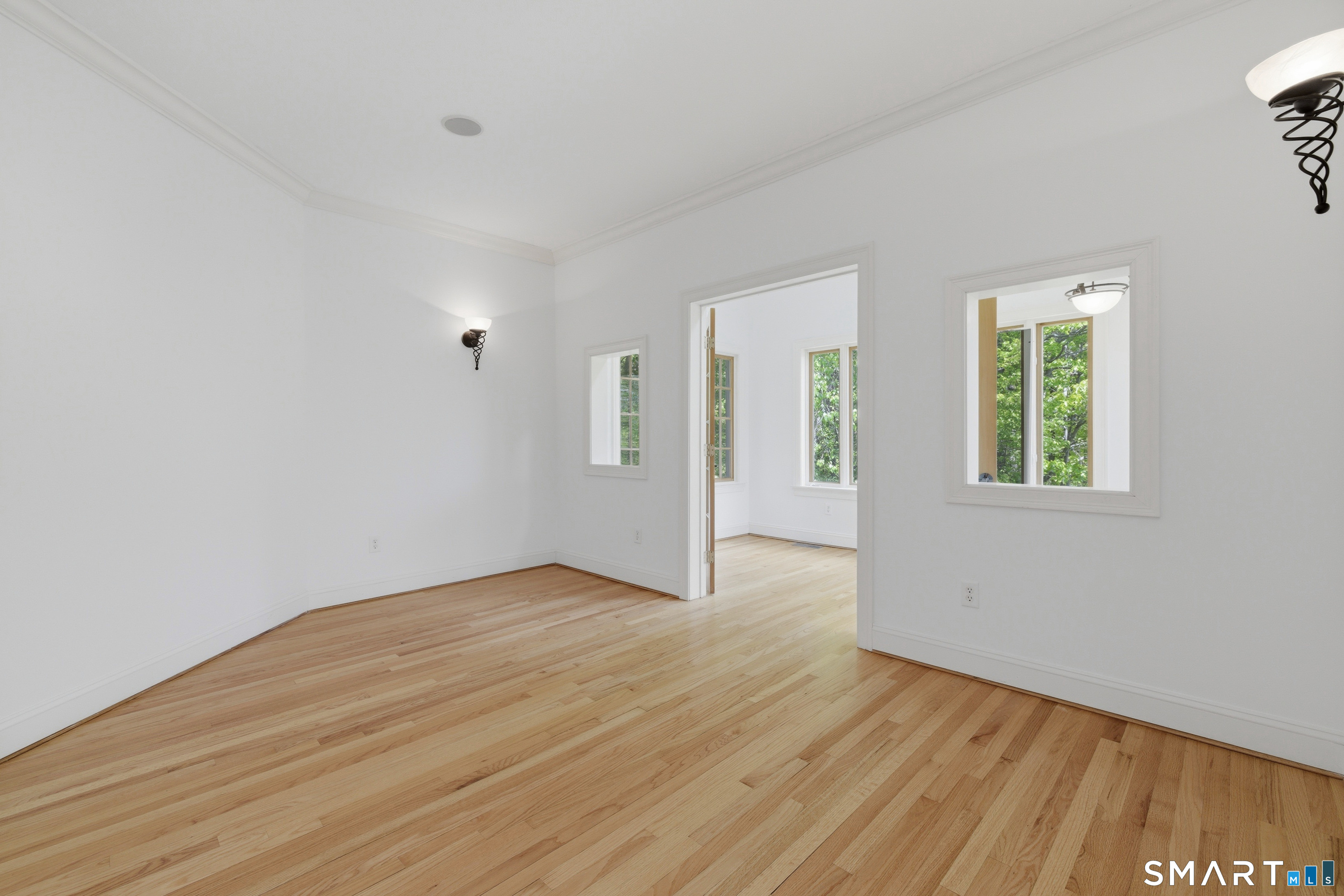 7 Mountainside Road West Hartford, CT 06117 - Photo 30 of 40 an empty room with wooden floor and windows