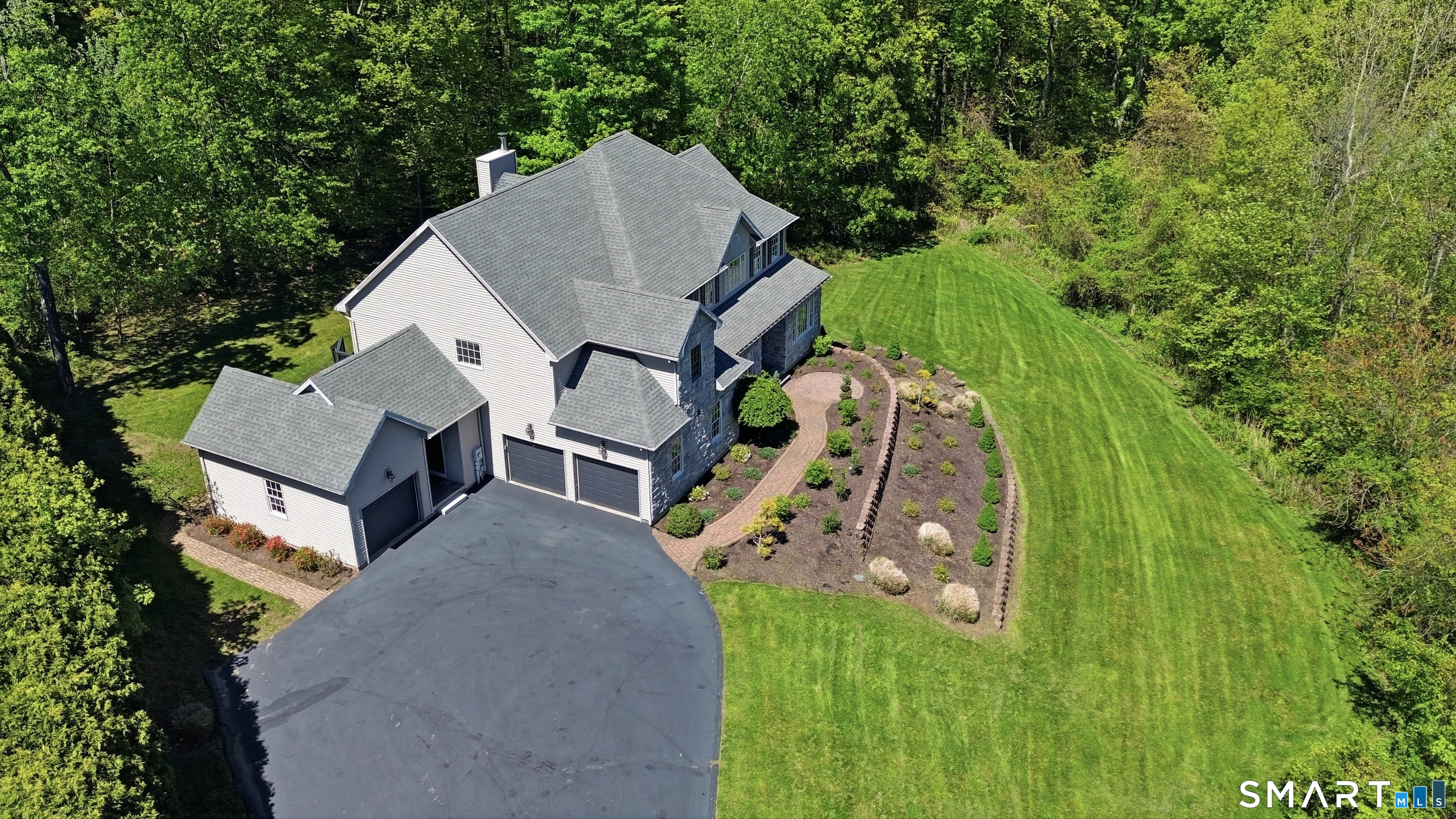 7 Mountainside Road West Hartford, CT 06117 - Photo 3 of 40 an aerial view of a house with a yard and trees