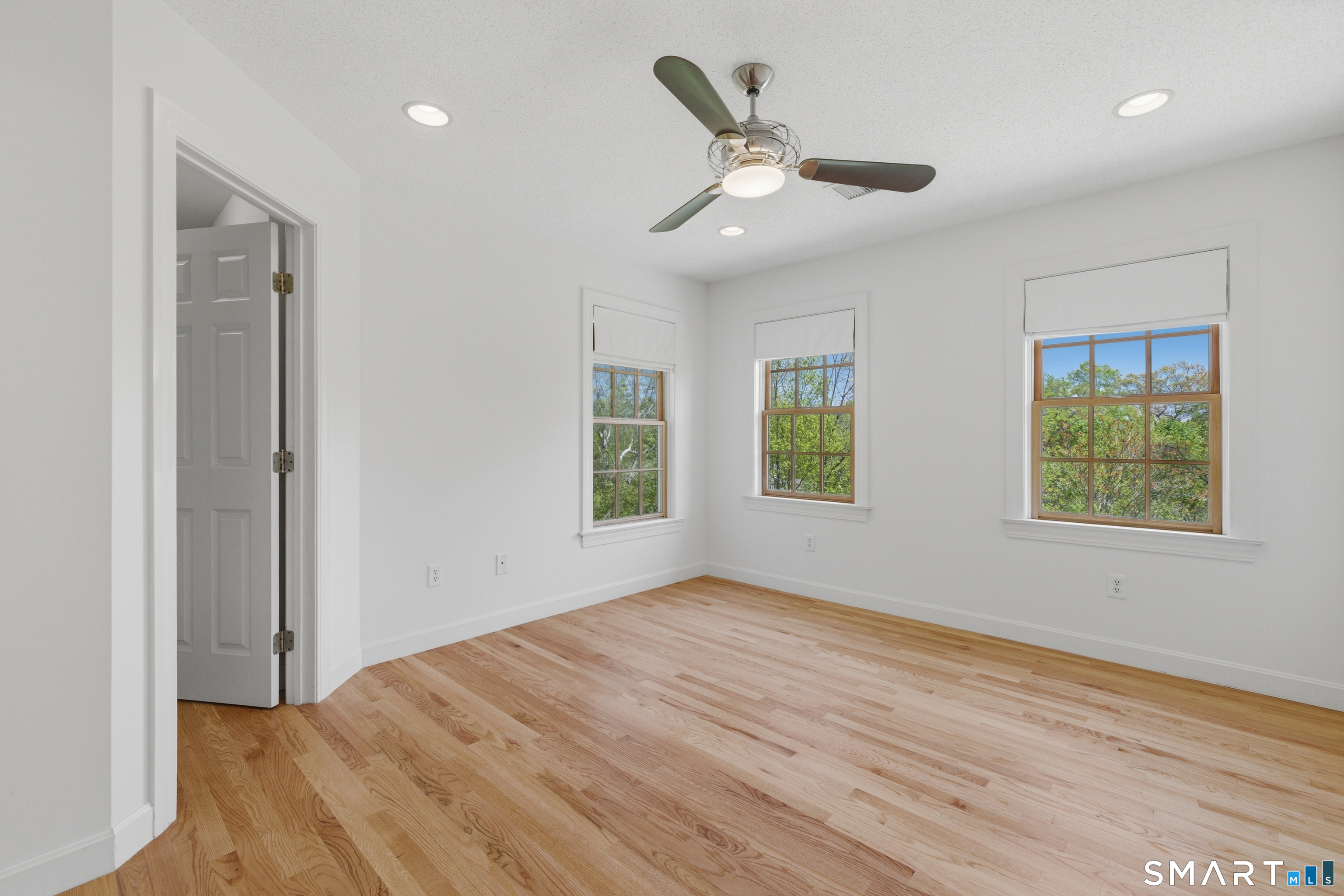 7 Mountainside Road West Hartford, CT 06117 - Photo 31 of 40 an empty room with wooden floor cabinet and windows