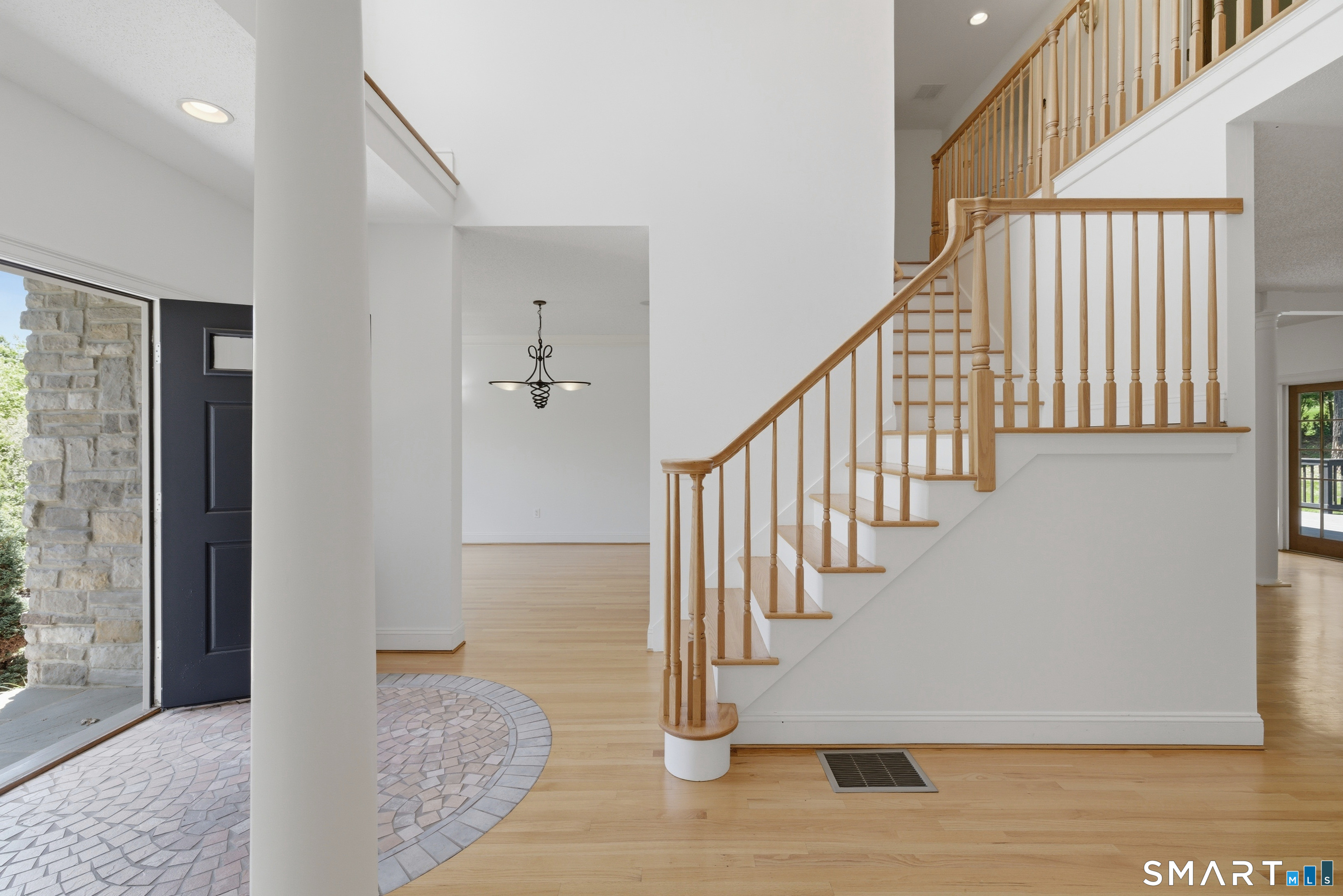 7 Mountainside Road West Hartford, CT 06117 - Photo 5 of 40 a view of entryway and hall with wooden floor