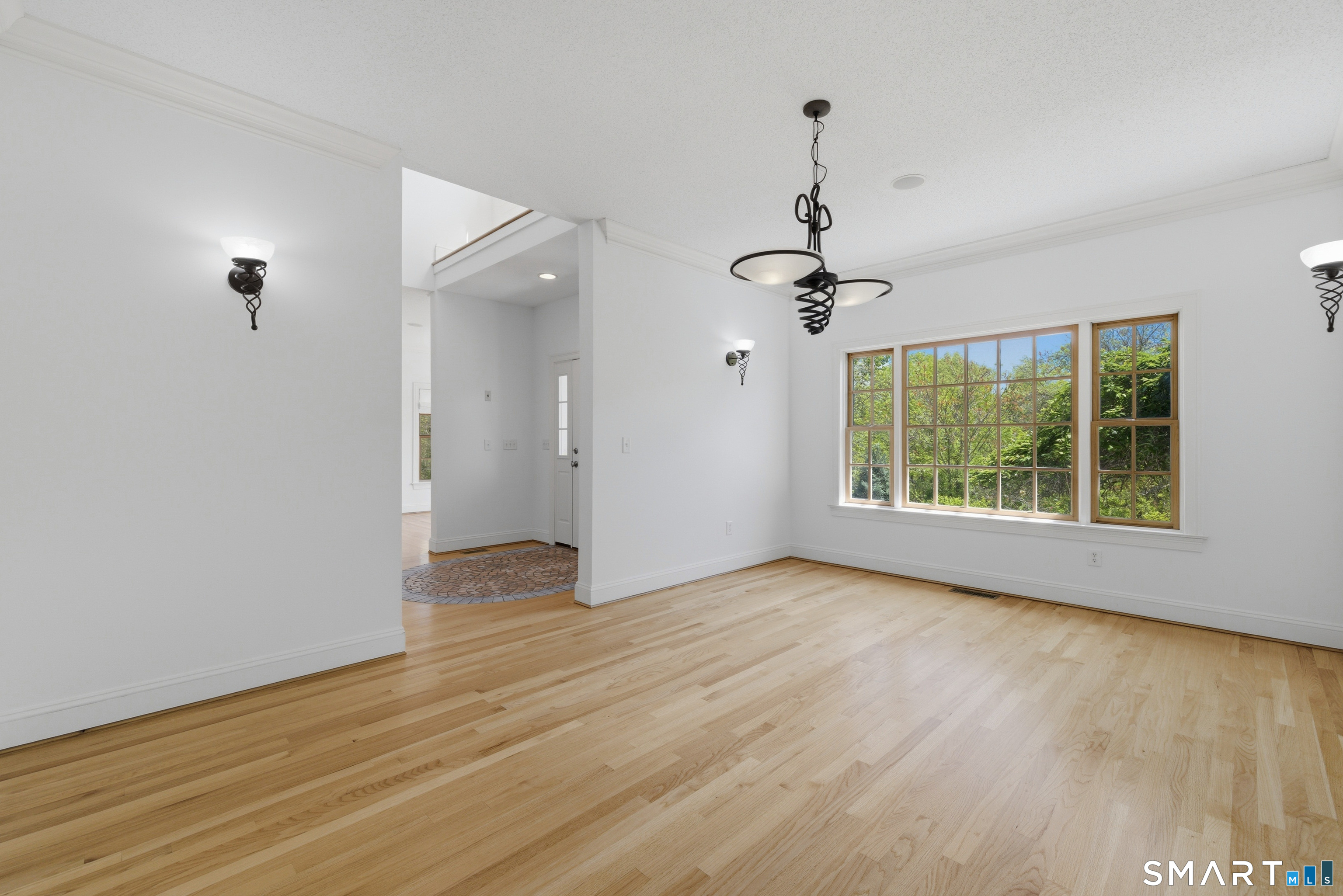 7 Mountainside Road West Hartford, CT 06117 - Photo 8 of 40 wooden floor in an empty room with a window