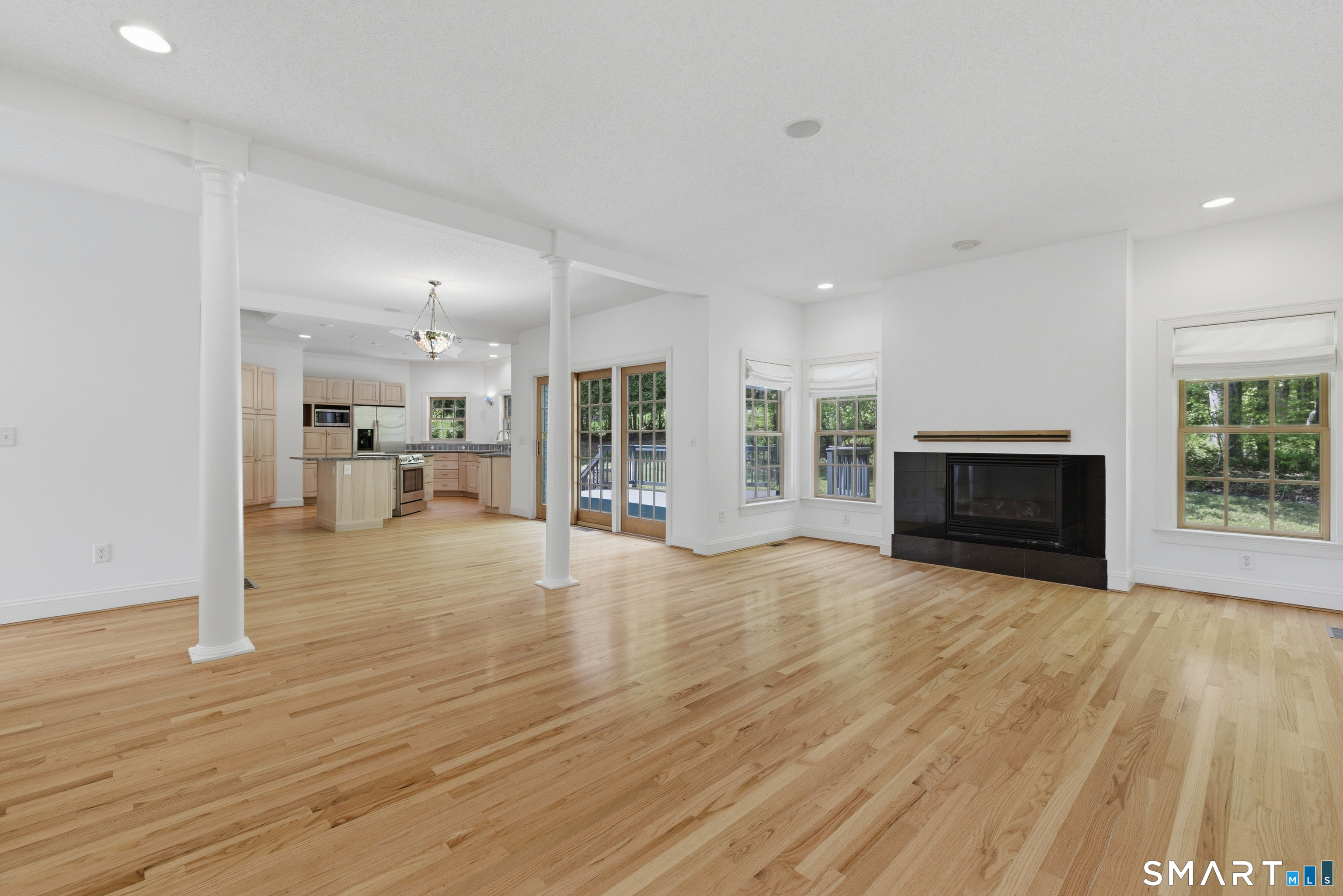 7 Mountainside Road West Hartford, CT 06117 - Photo 10 of 40 a view of a livingroom with furniture wooden floor and a fireplace