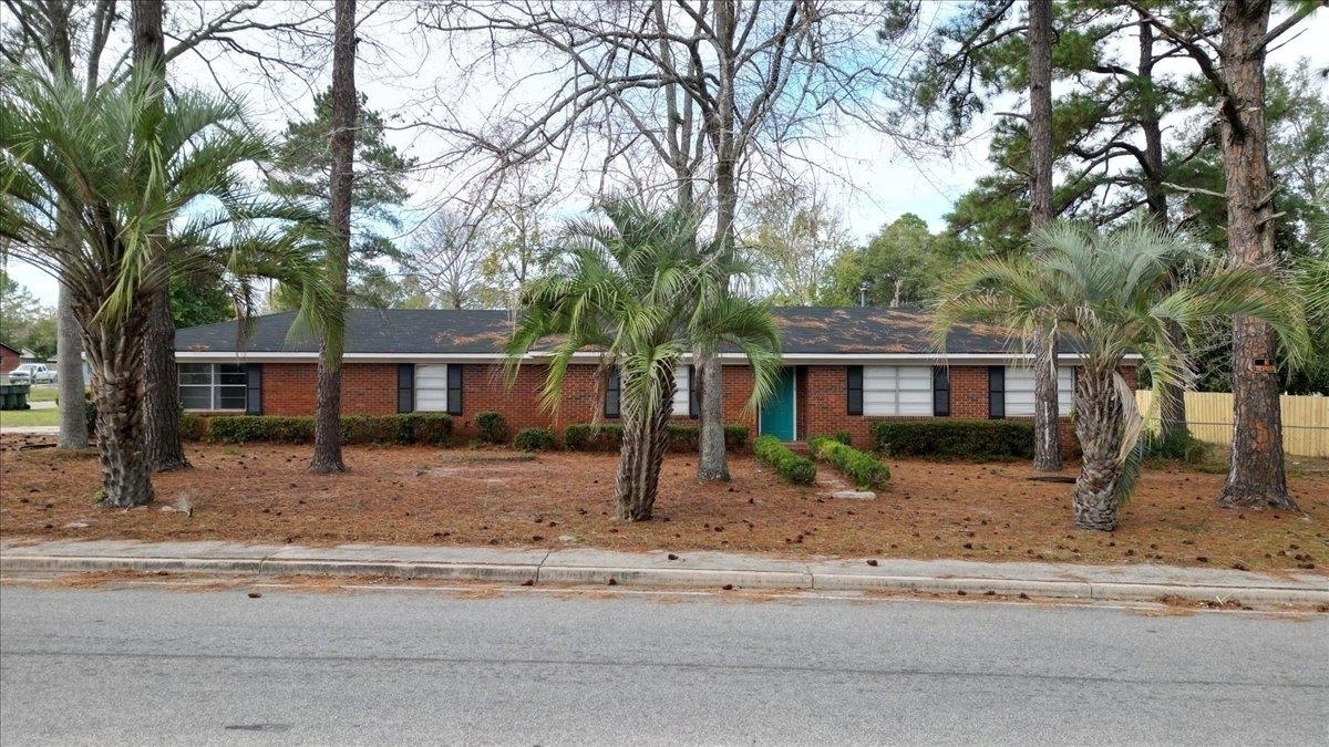 611 North Fourth Street Jesup, GA 31545 - Photo 1 of 1 a view of a house with a yard covered in snow