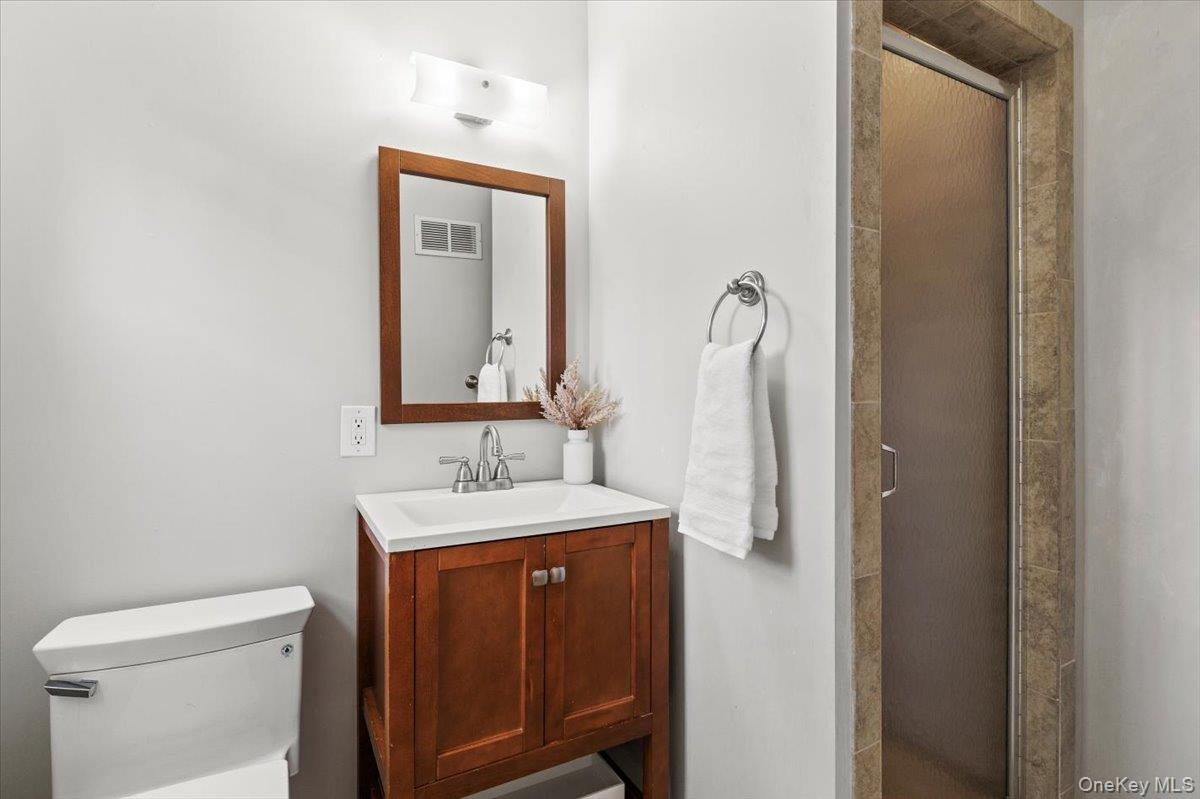 22 Old Orchard Road Rye Brook, NY 10573 - Photo 16 of 30 Primary bathroom features a stall shower and vanity
