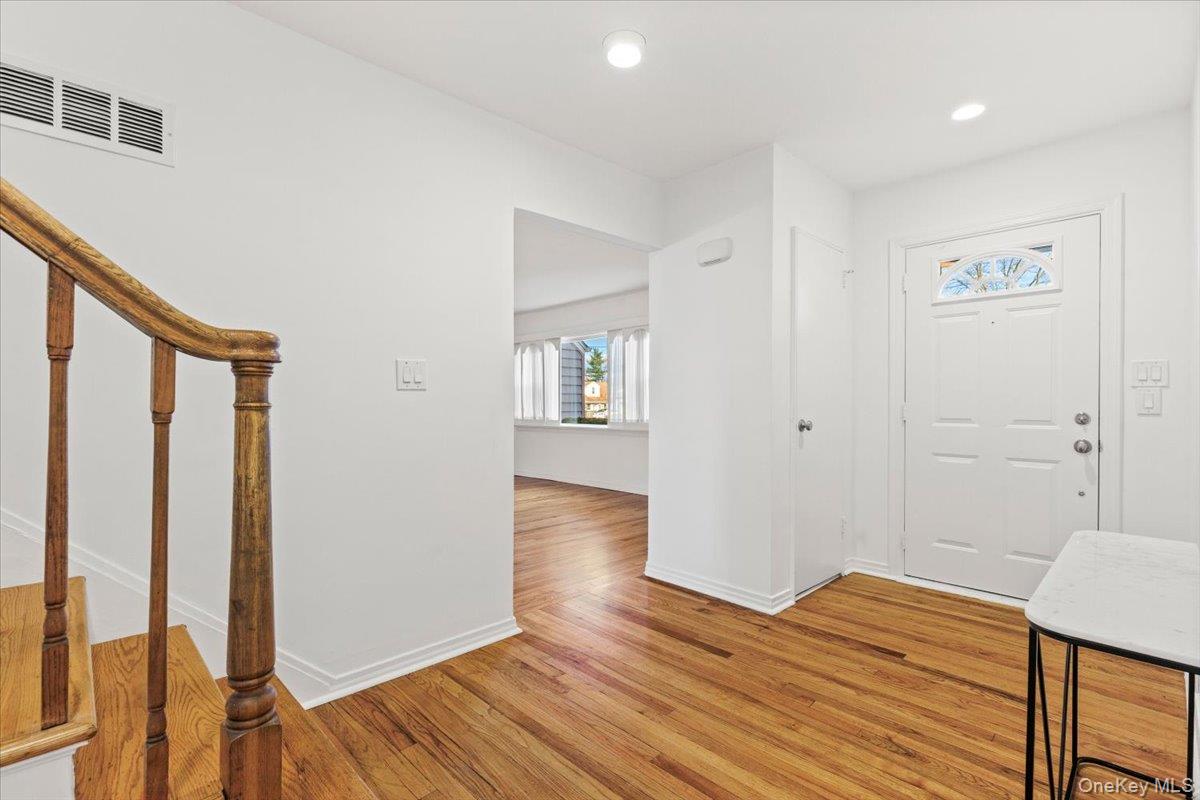 22 Old Orchard Road Rye Brook, NY 10573 - Photo 2 of 30 Entrance foyer featuring stairway, light wood-style floors, and recessed lighting