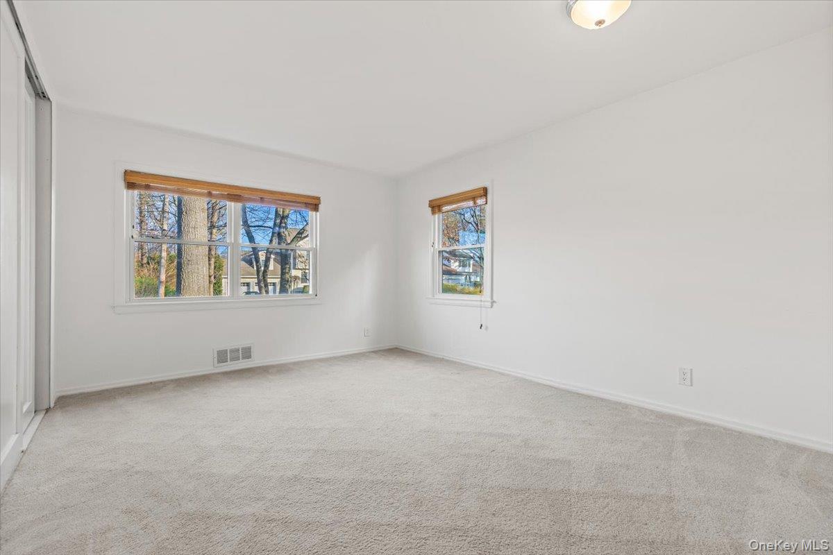 22 Old Orchard Road Rye Brook, NY 10573 - Photo 21 of 30 Large first floor bedroom with oversized double closet with custom built-ins