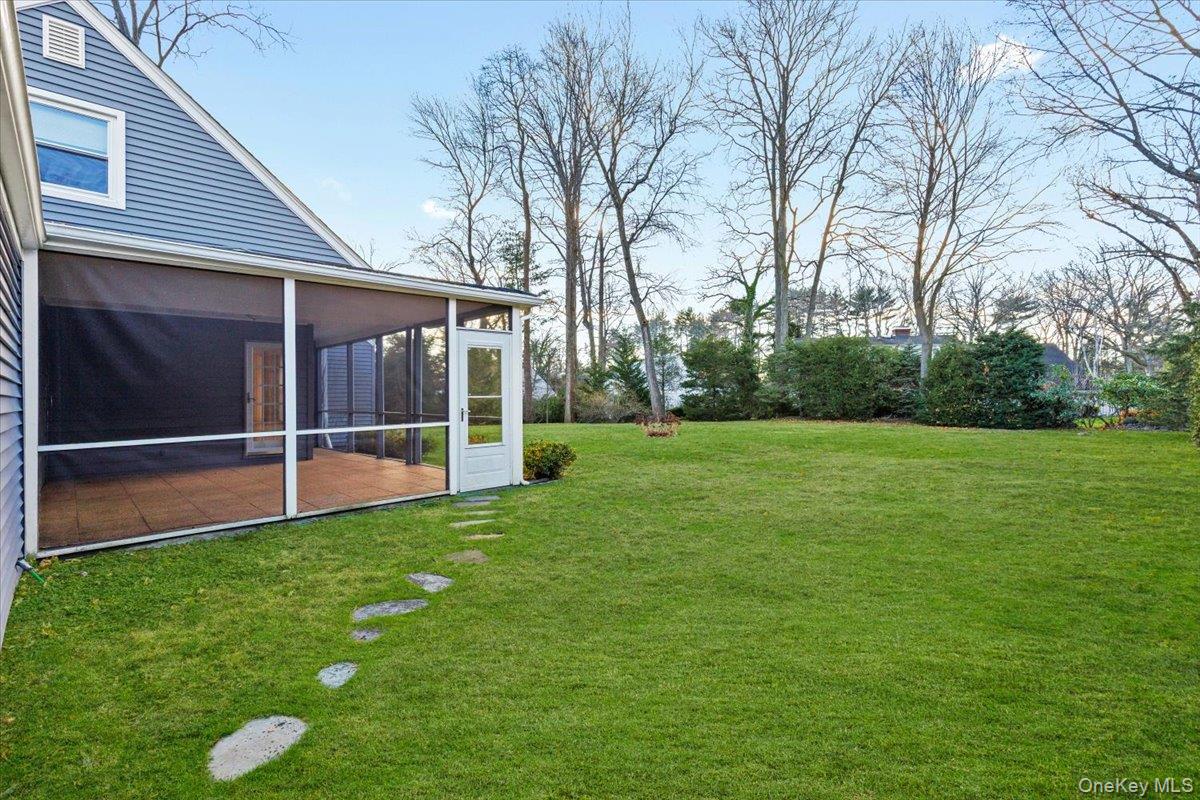 22 Old Orchard Road Rye Brook, NY 10573 - Photo 24 of 30 View of green lawn with screened in porch