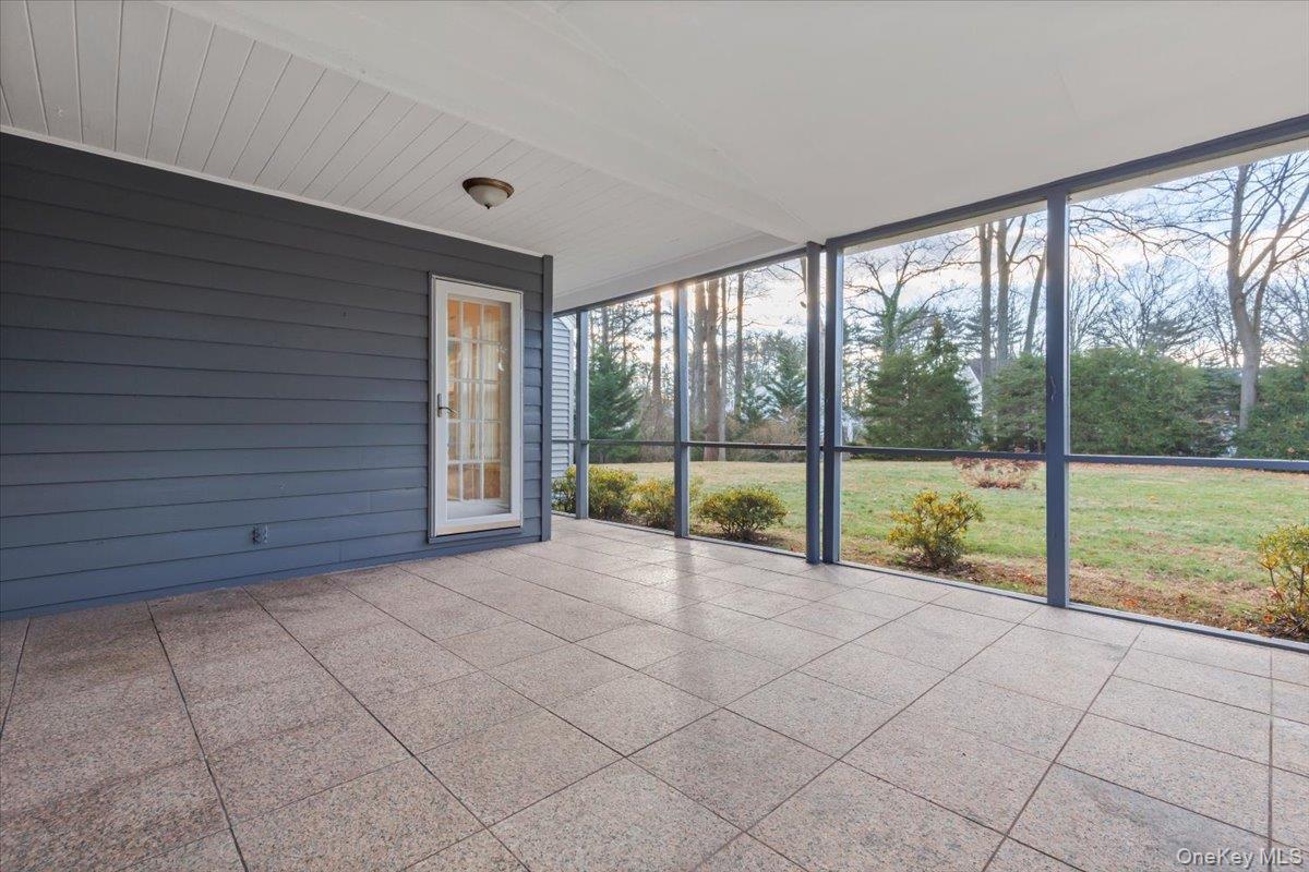 22 Old Orchard Road Rye Brook, NY 10573 - Photo 8 of 30 Screened in porch leads to rear yard and two car garage. Screened in porch offers endless possibilities