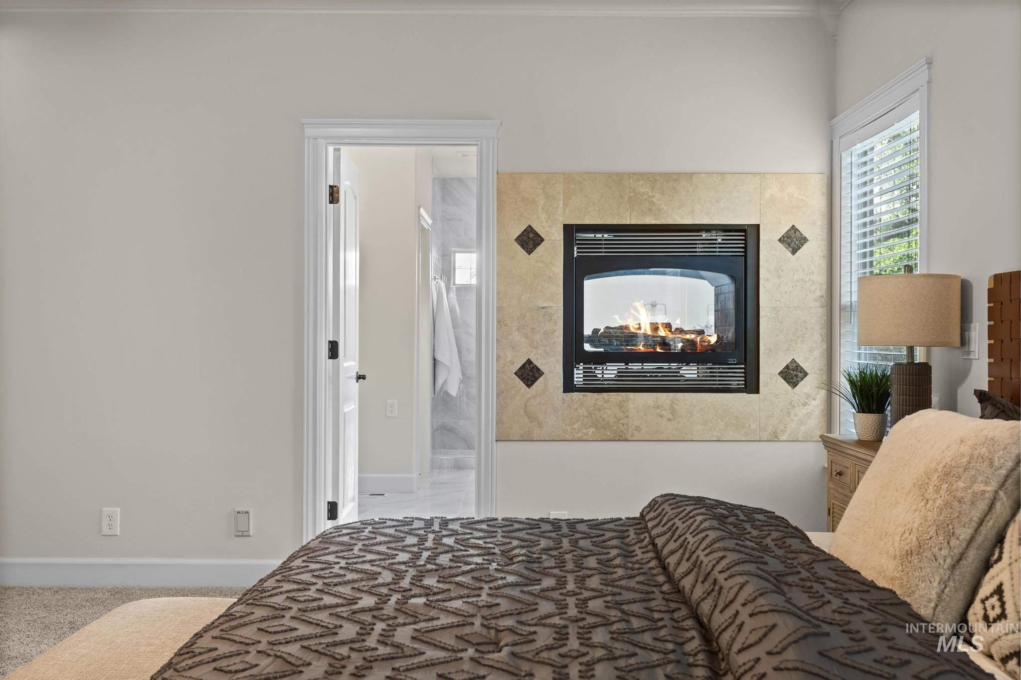 4946 North Villa Ridge Way Boise, ID 83703 - Photo 19 of 49 Built-in fireplace featuring a tiled surround with decorative accents
