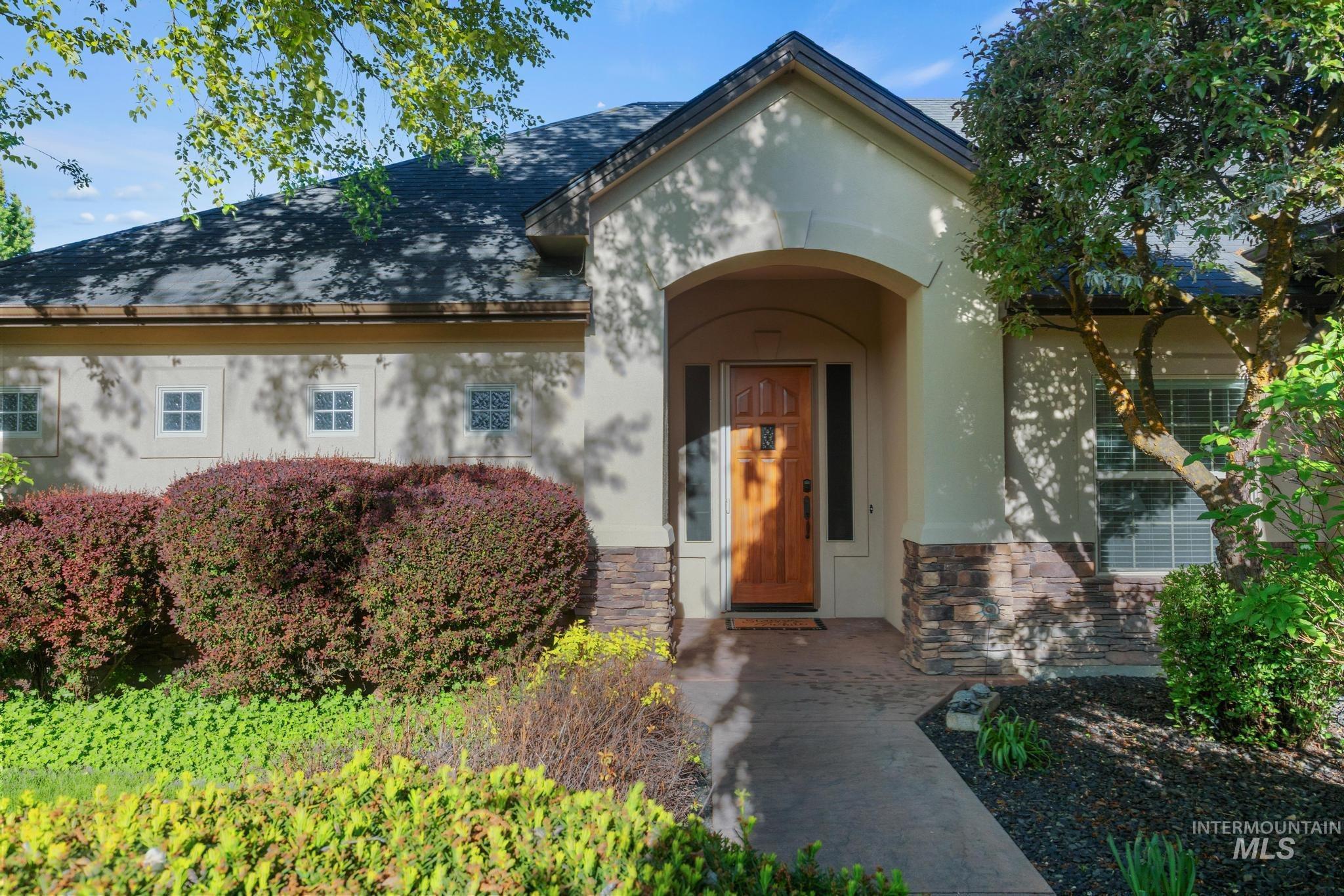 4946 North Villa Ridge Way Boise, ID 83703 - Photo 2 of 49 Stucco exterior with stone veneer accents and a gabled roofline