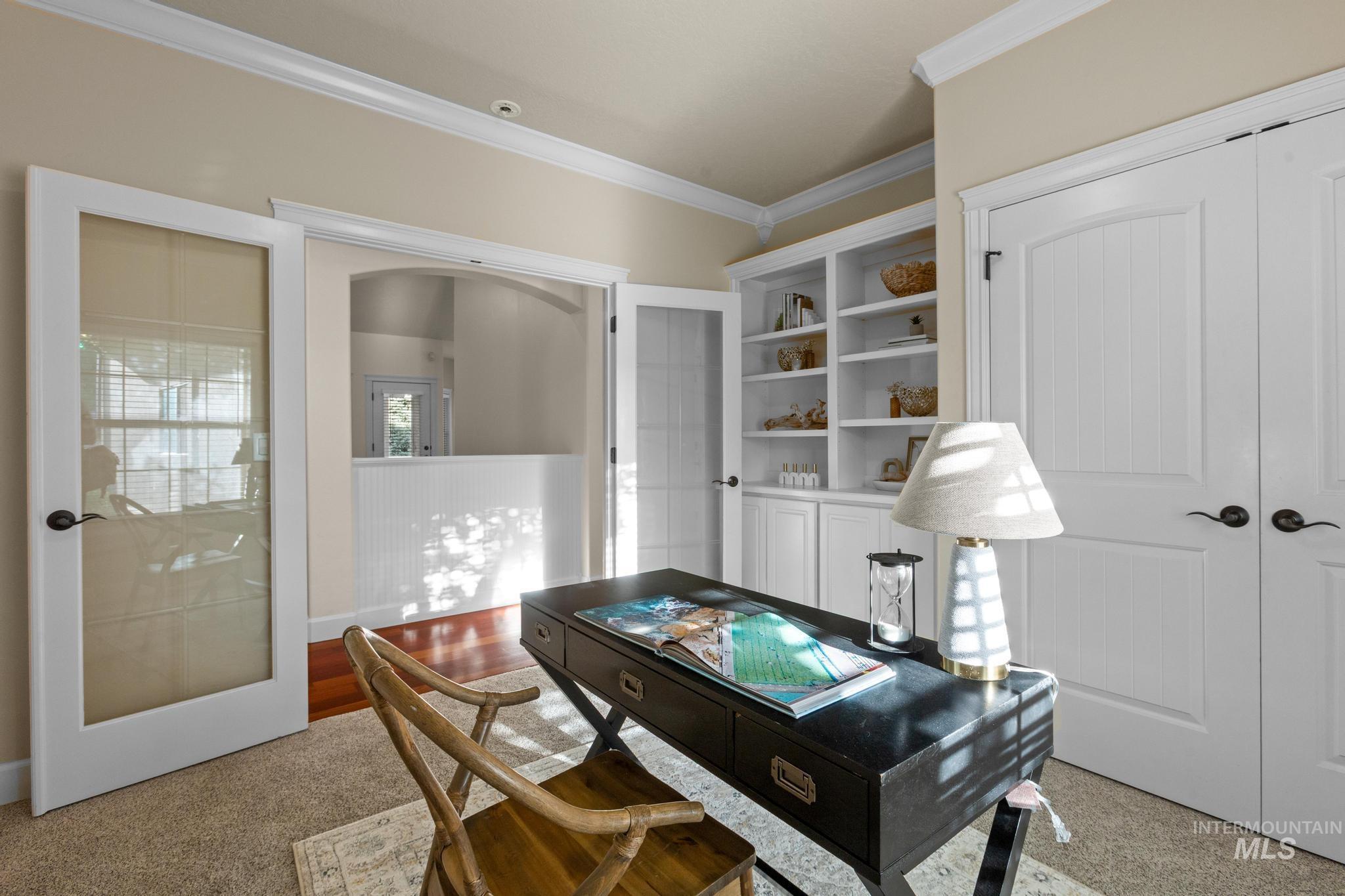 4946 North Villa Ridge Way Boise, ID 83703 - Photo 28 of 49 Dedicated space featuring built-in shelving, crown molding, and two sets of double doors