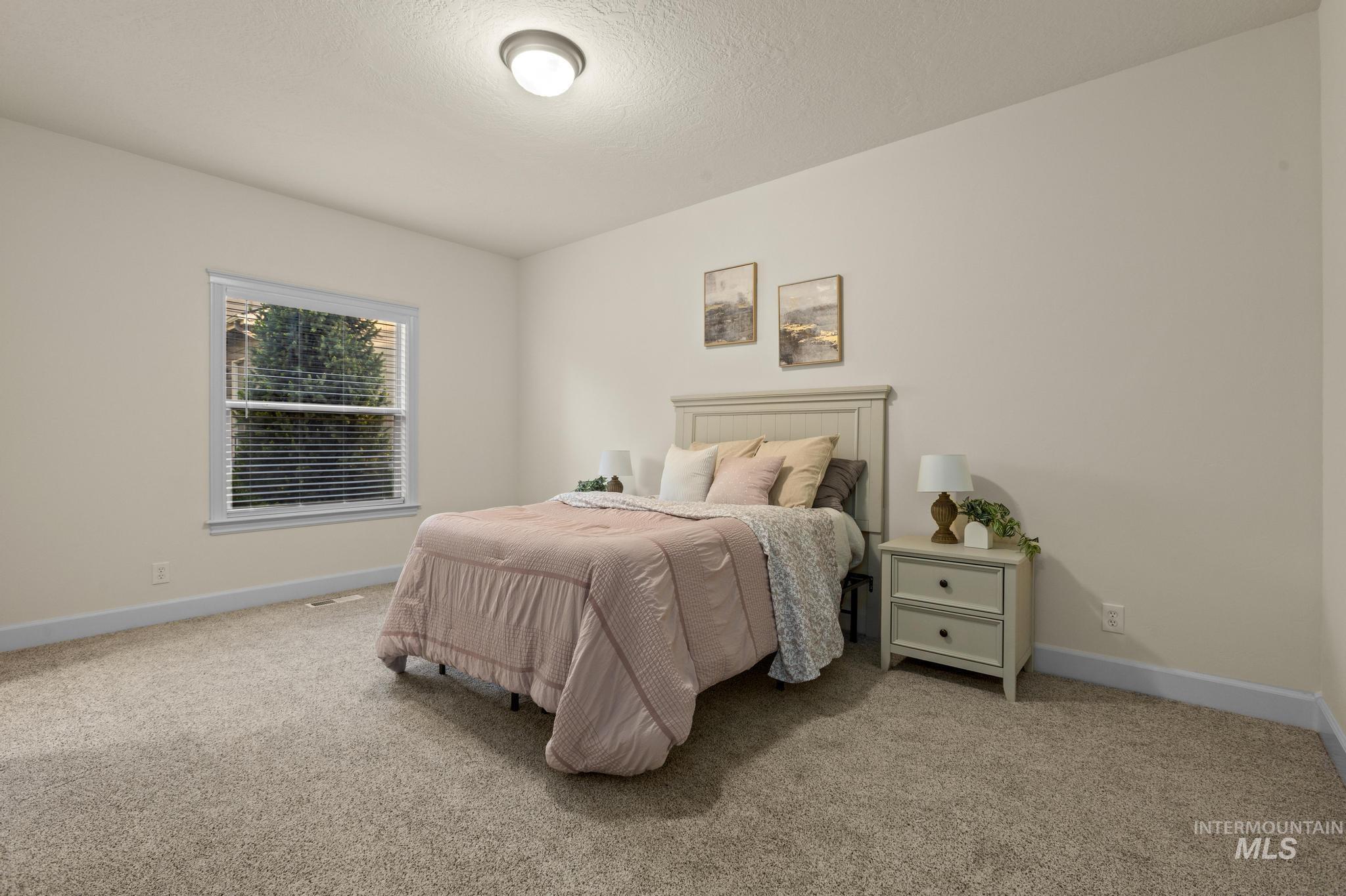 4946 North Villa Ridge Way Boise, ID 83703 - Photo 34 of 49 Carpeted interior with neutral wall tones and a single window with blinds