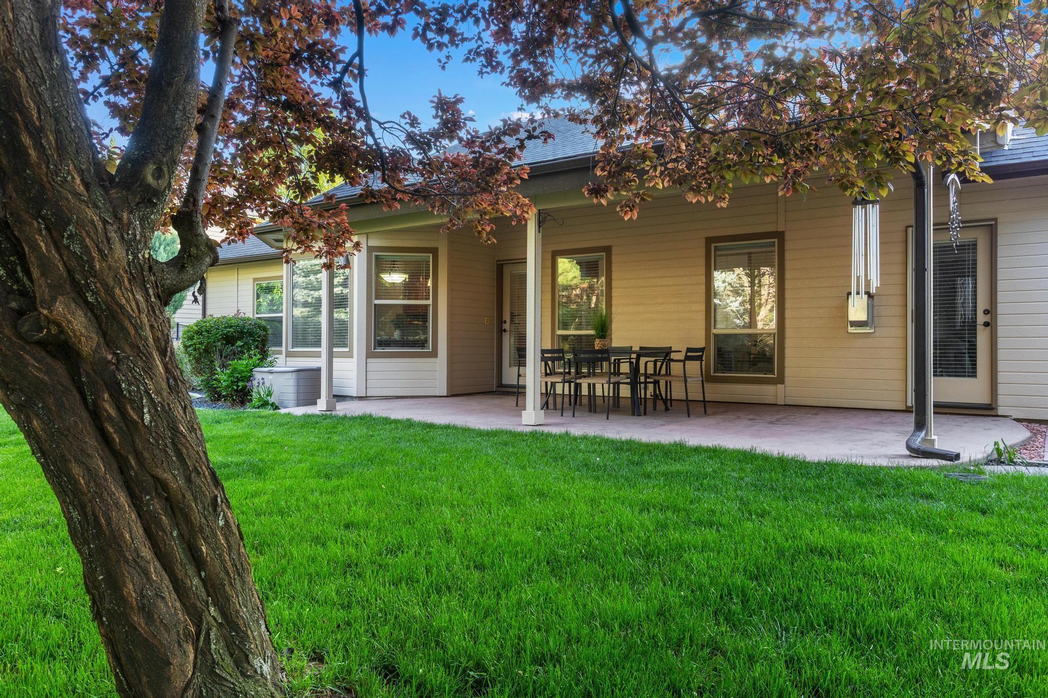 4946 North Villa Ridge Way Boise, ID 83703 - Photo 43 of 49 Expansive grassy lawn with a mature tree providing natural shade