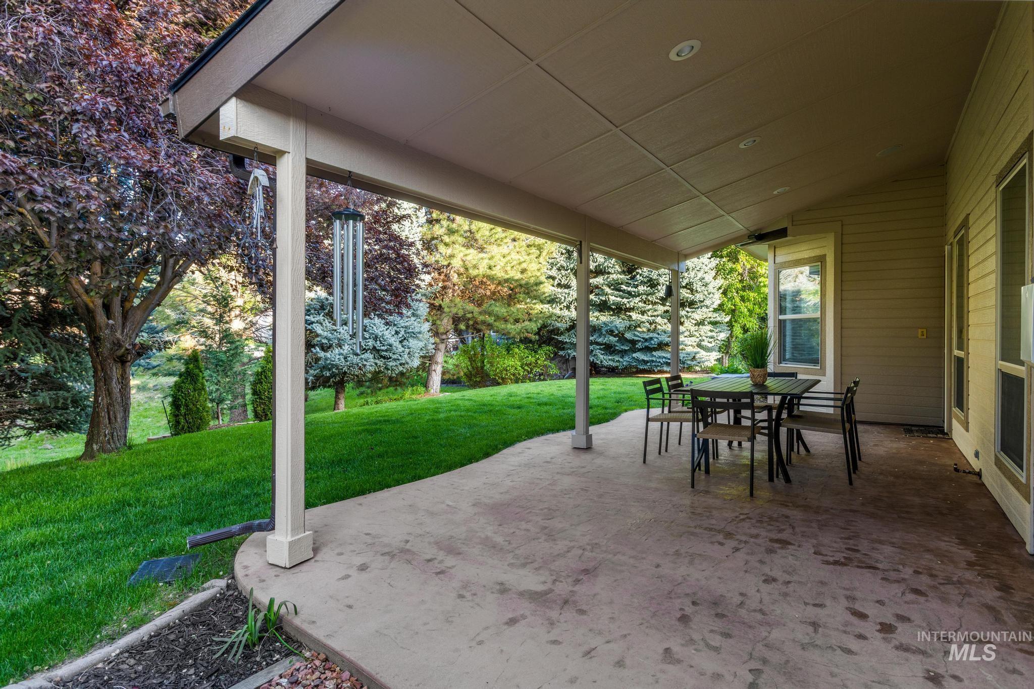 4946 North Villa Ridge Way Boise, ID 83703 - Photo 44 of 49 Covered patio with concrete surface, recessed lighting, and a sloping green lawn
