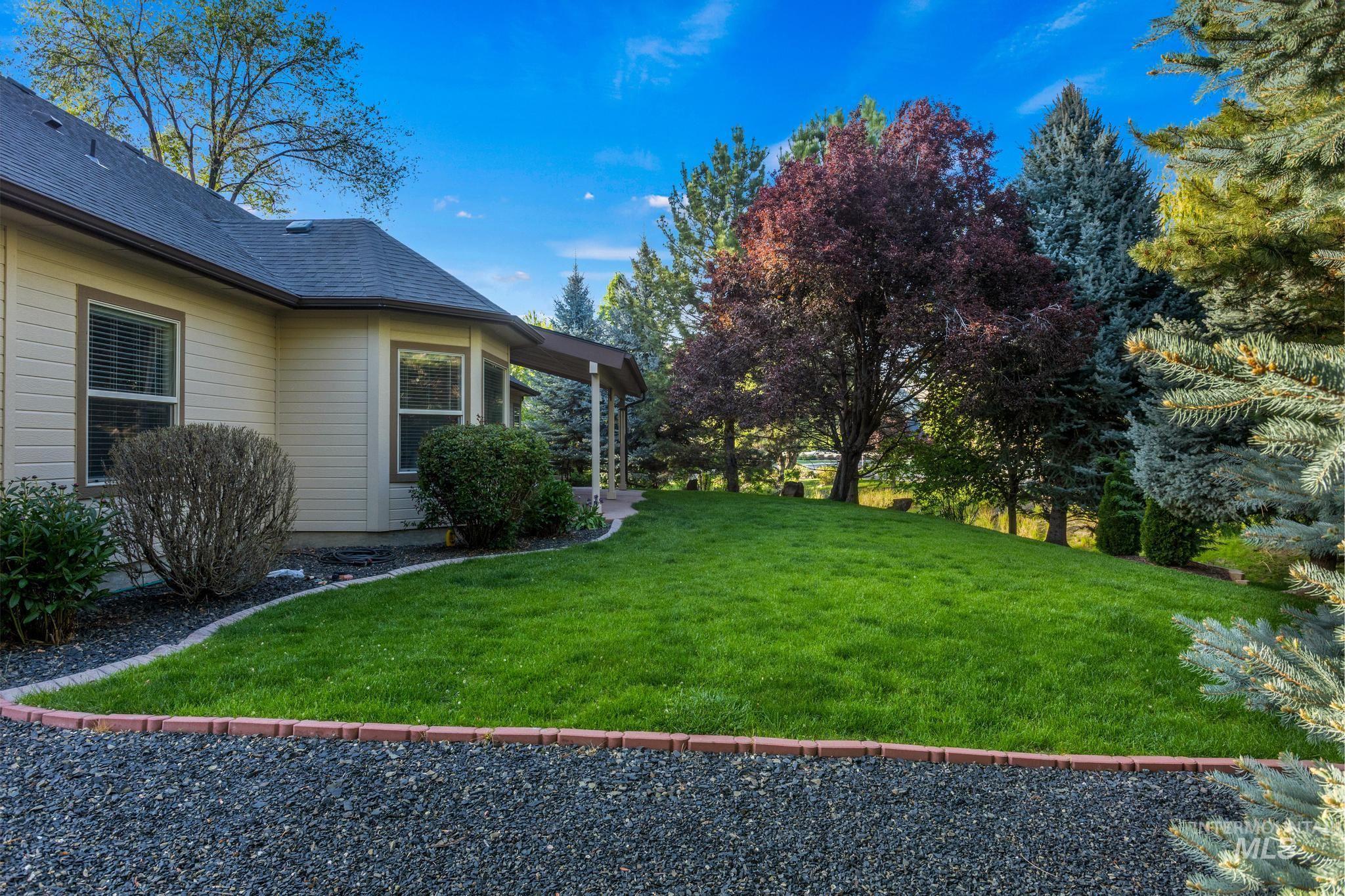 4946 North Villa Ridge Way Boise, ID 83703 - Photo 45 of 49 Exterior siding with bay windows and a covered patio