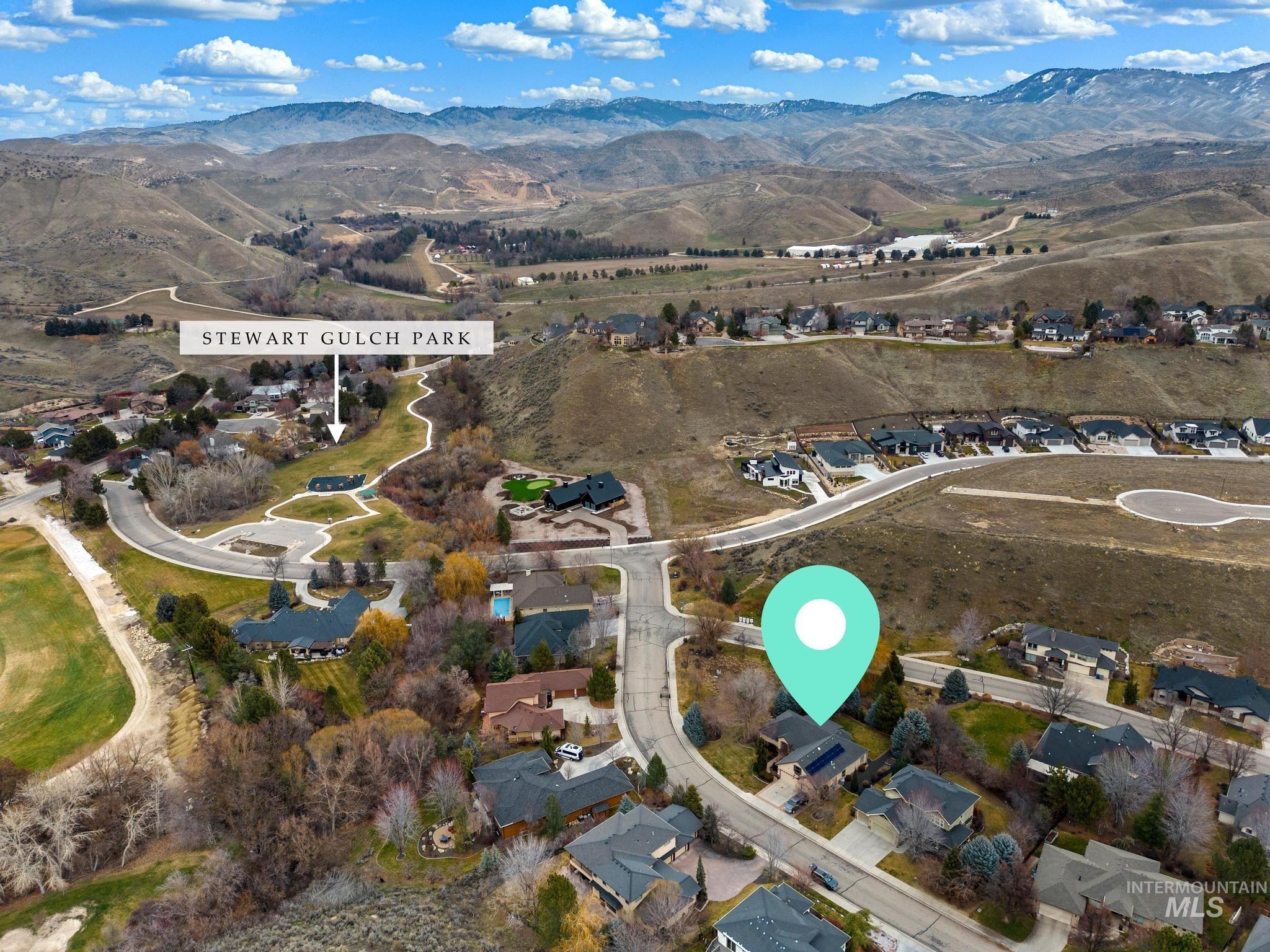4946 North Villa Ridge Way Boise, ID 83703 - Photo 47 of 49 Aerial neighborhood view featuring residential properties with surrounding hills and distant mountains